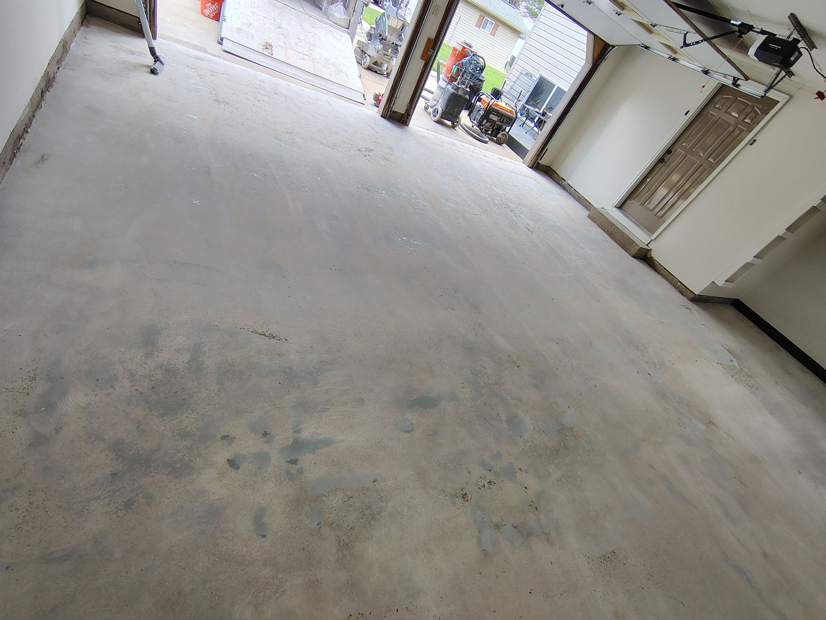 Full-Flake Epoxy Garage Floor Coating Installation in Sioux Falls by Select Painting, Coatings & Garage Cabinets
