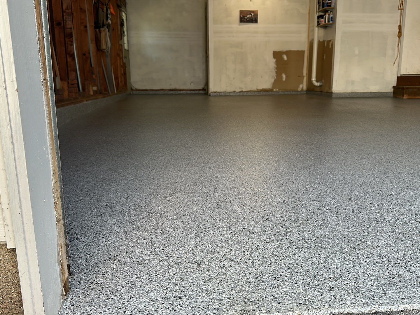 Silverado garage floor coating  by NG Masonry & Construction LLC