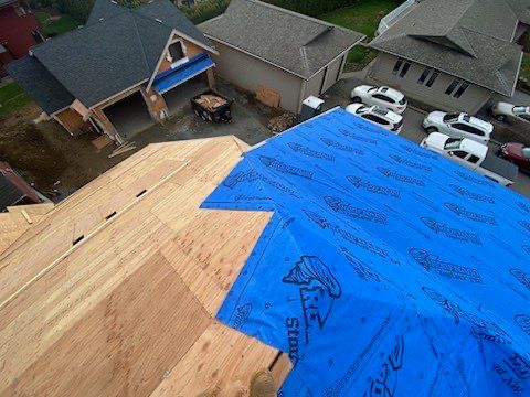 Residential Roofing Installation using Malarky Vista Midnight black by Top Notch Roofing Inc