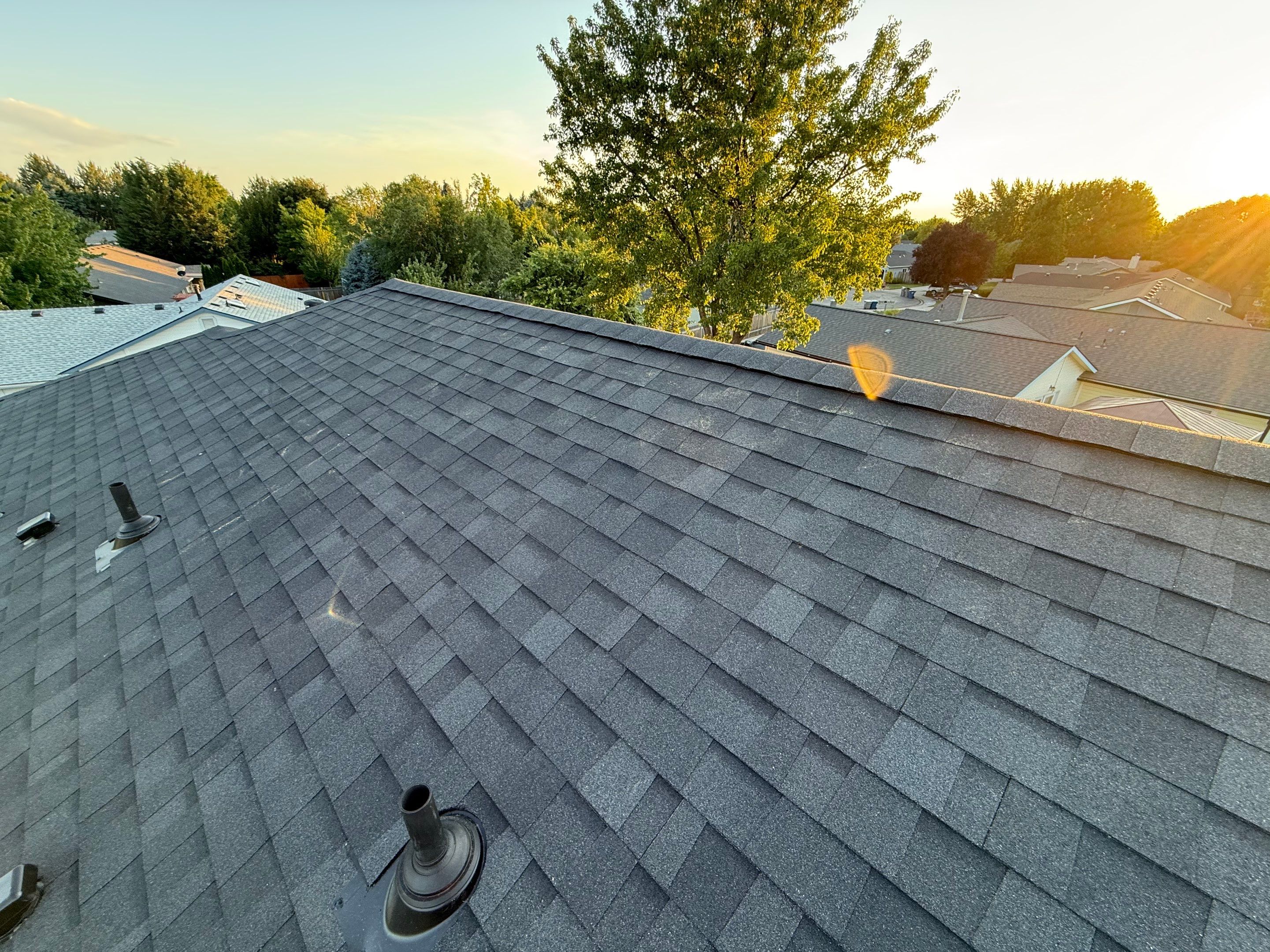 Residential Roof Replacement and Seamless Gutter Installation in Boise by Olive Roofing