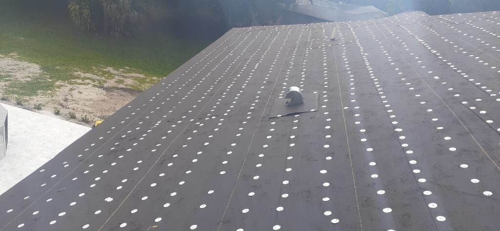 Residential Roofing Installation using 1" Nail strip metal roof by BLUES BROTHERS CONSTRUCTION CORP