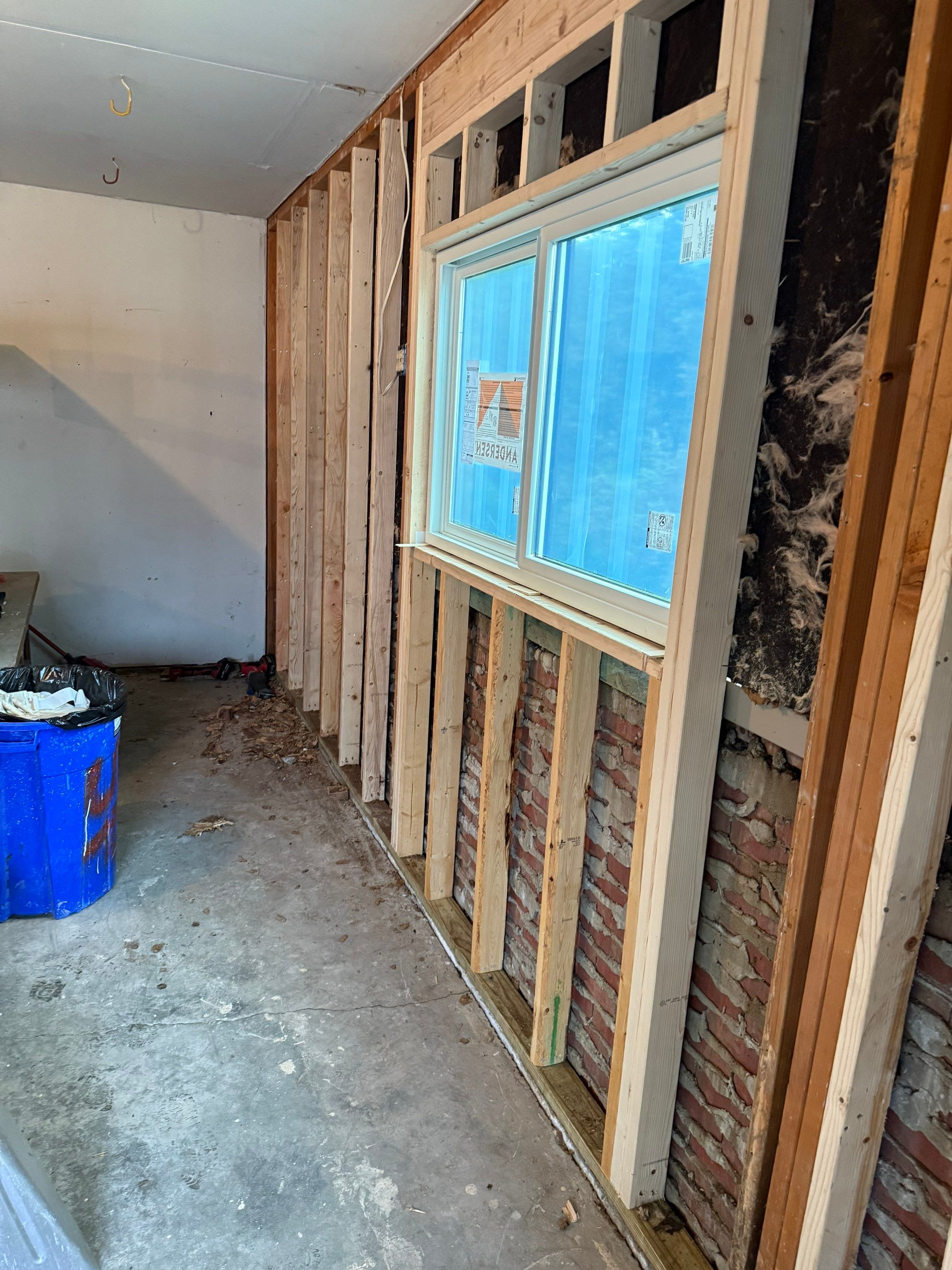 Yankton Garage Remodel with Andersen Window Installation and Drywall by Select Painting, Coatings & Garage Cabinets