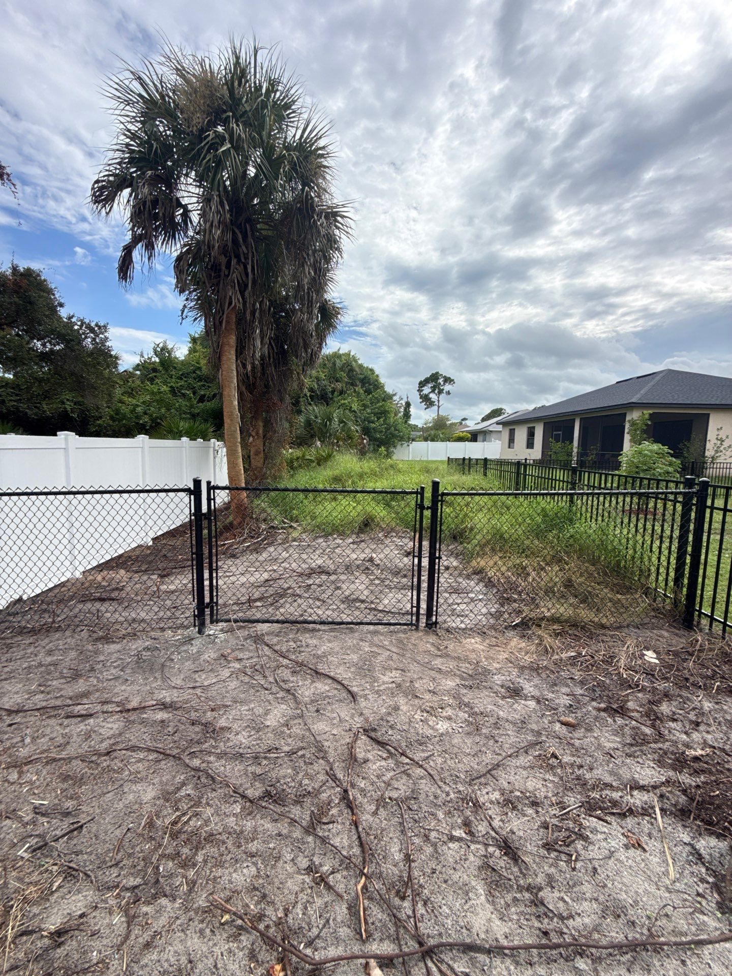 White Vinyl Privacy Fence Installation in North Port Florida by True Fence LLC