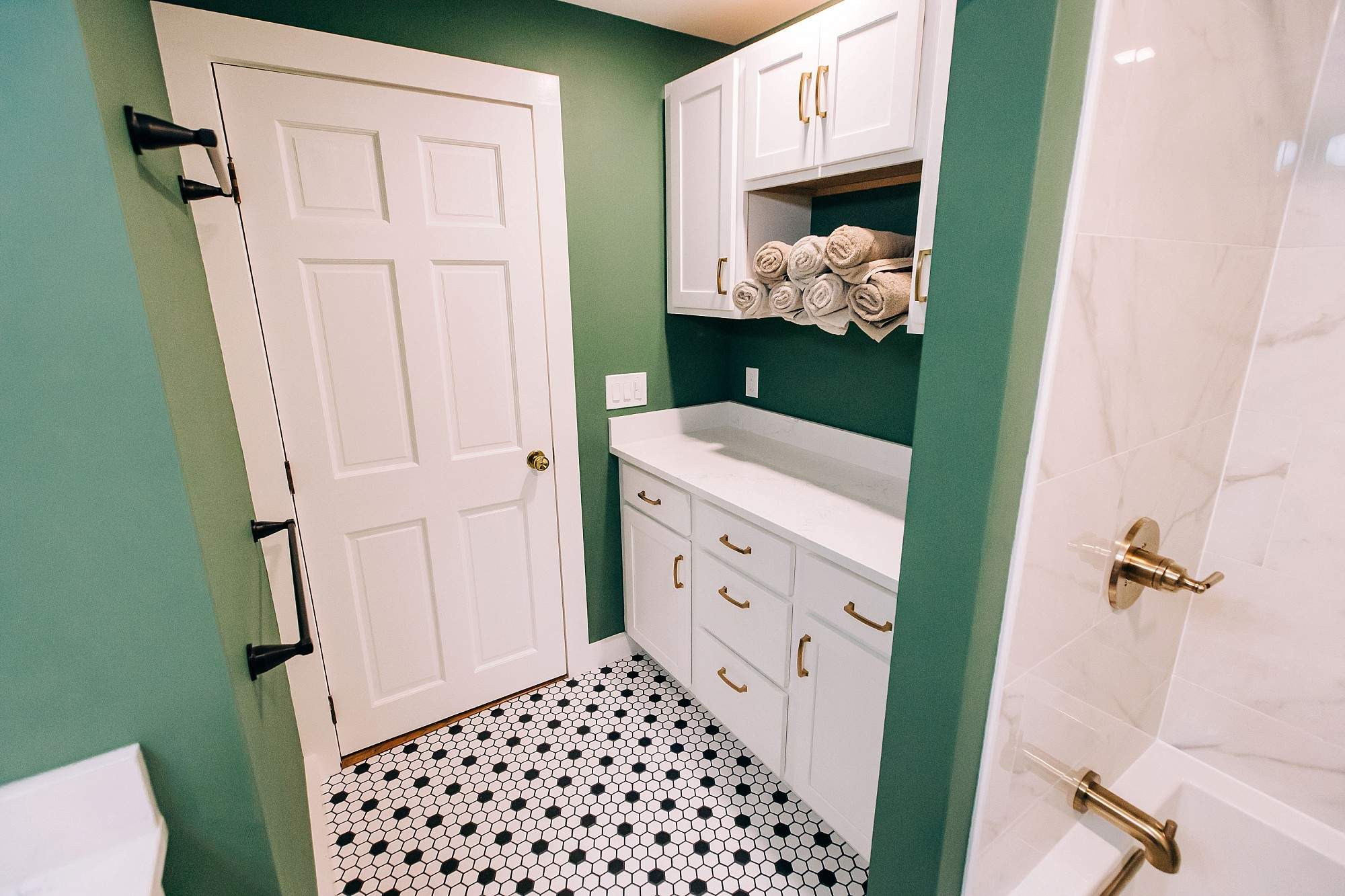 Green & Gold Bathroom by Renovatic LLC