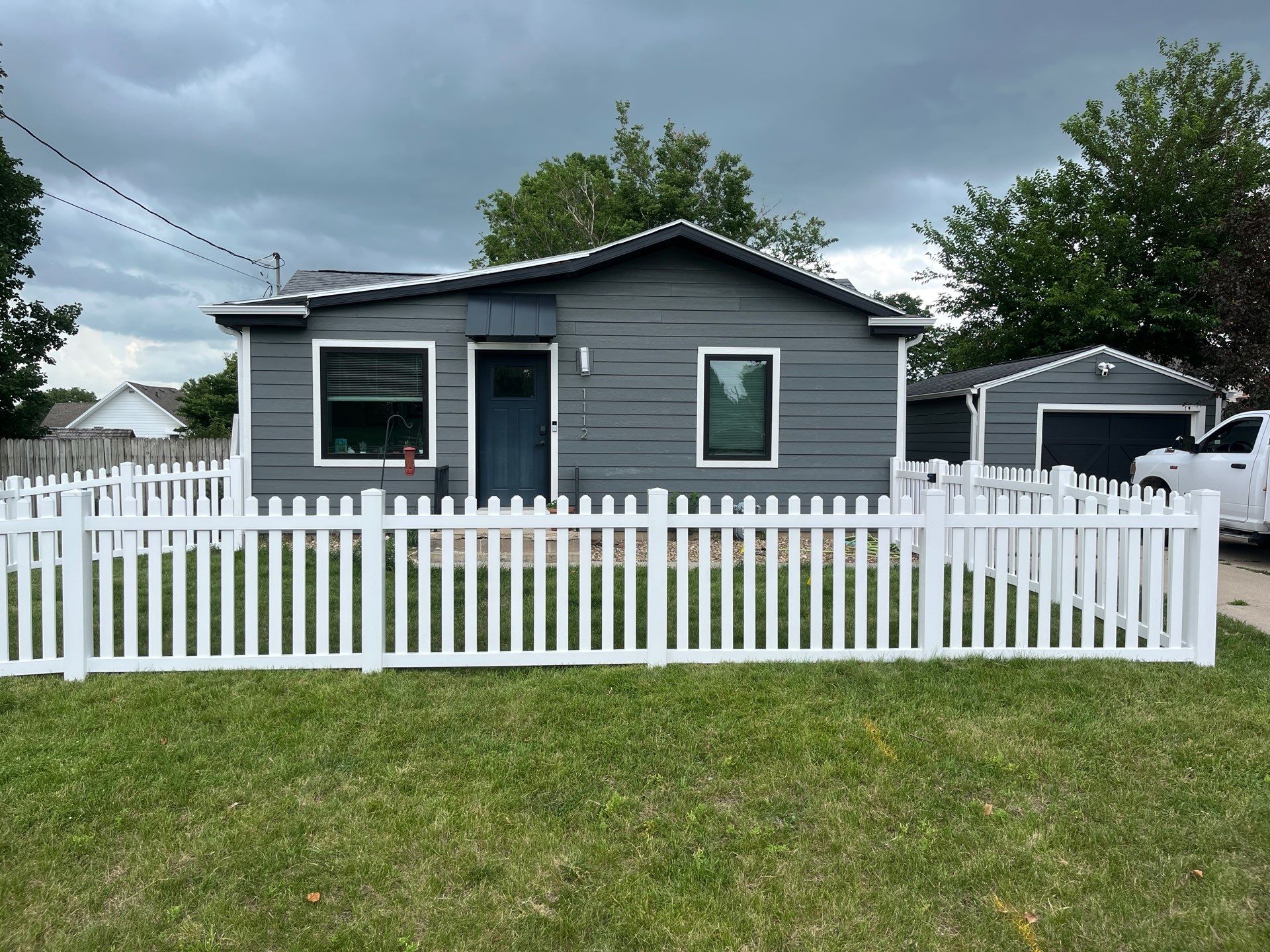 White Vinyl Spaced Picket Fence Installation in Cedar Falls by Perfect Picket Fence and Stain
