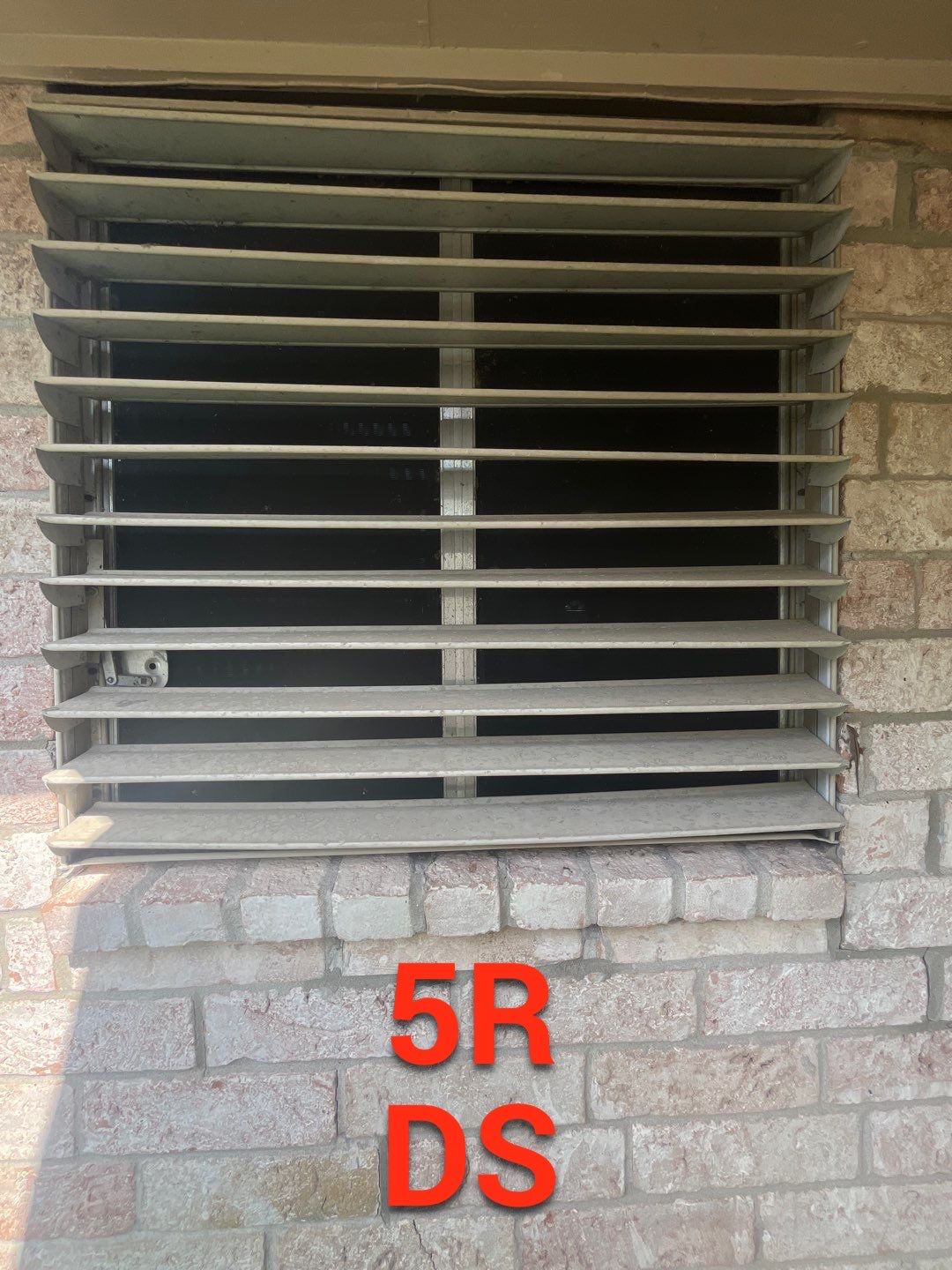 Colored Vinyl Windows to blend into brick by Bayfront Roofing and Construction