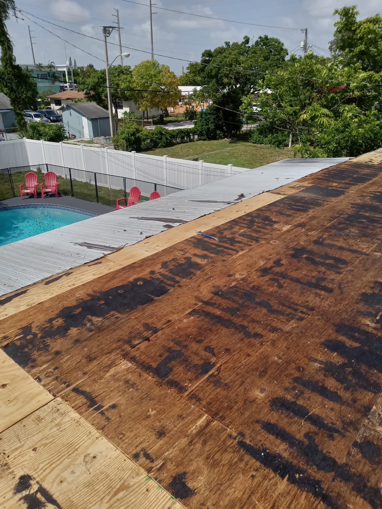 Standing Seam Metal & Flat Re-Roof using 1.5" Nail Strip 24ga Black Matte Kynar Coated Standing Seam Metal Panels by Morton Roofing, Inc.