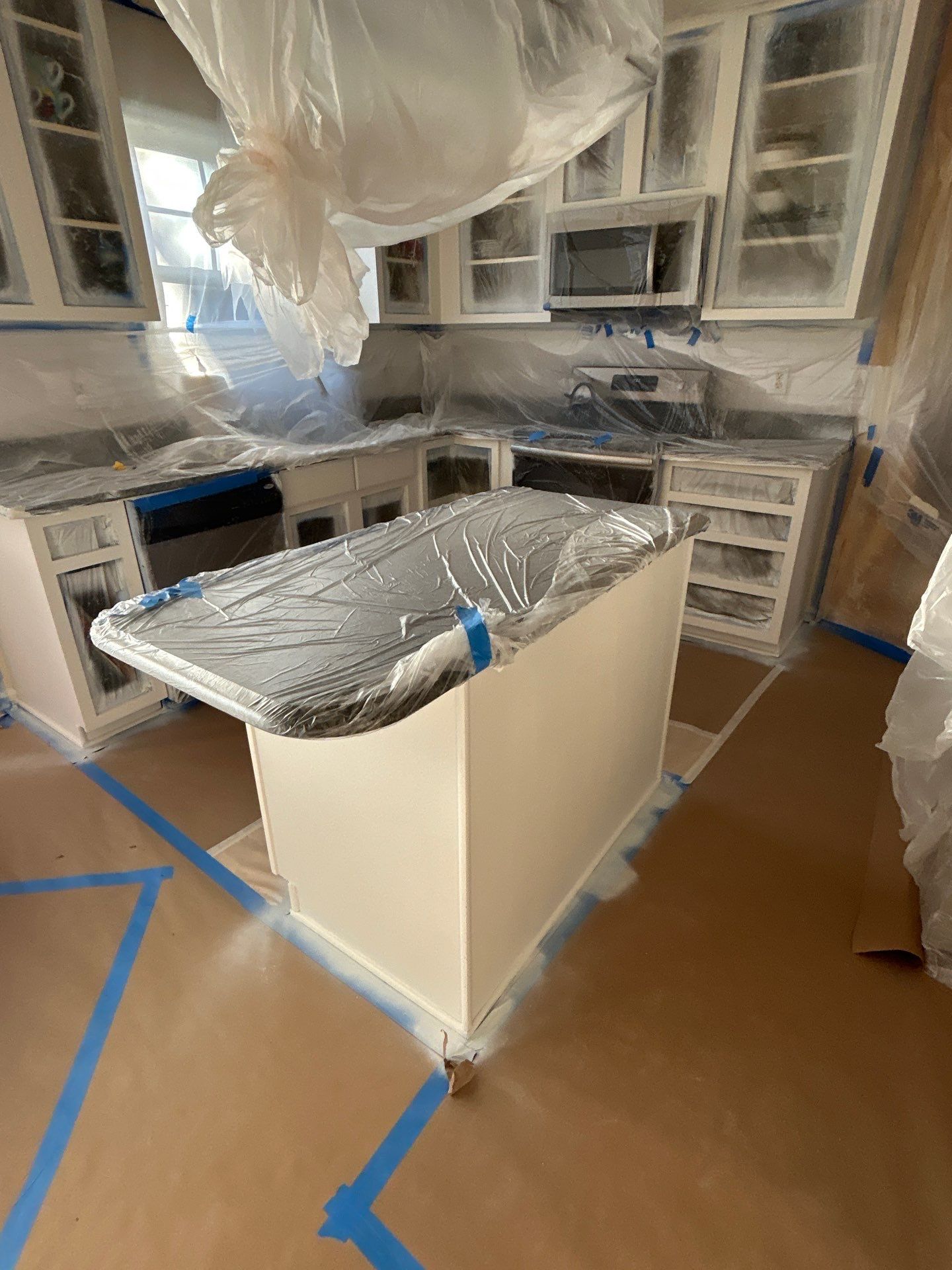 Cabinet painting by GonzalezPainters & Contractors Inc 