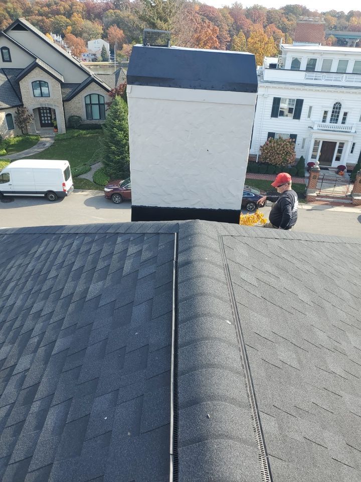 Residential Roofing Installation, Dec-tek walk-out porch roof, siding on garage by Absolute Roofing and Construction