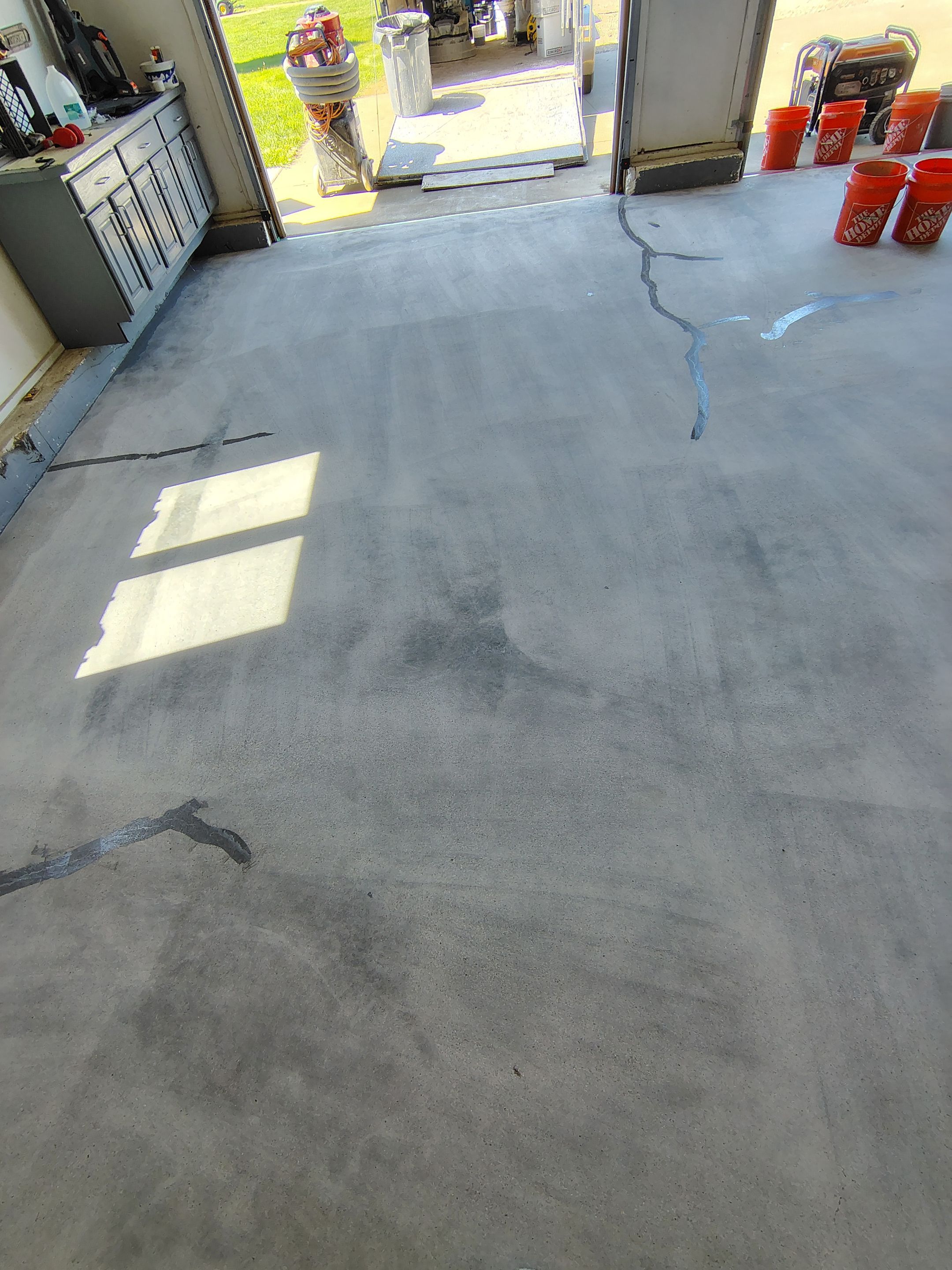 Feather Grey Garage Floor Coating Installation in Valley Springs by Select Painting, Coatings & Garage Cabinets