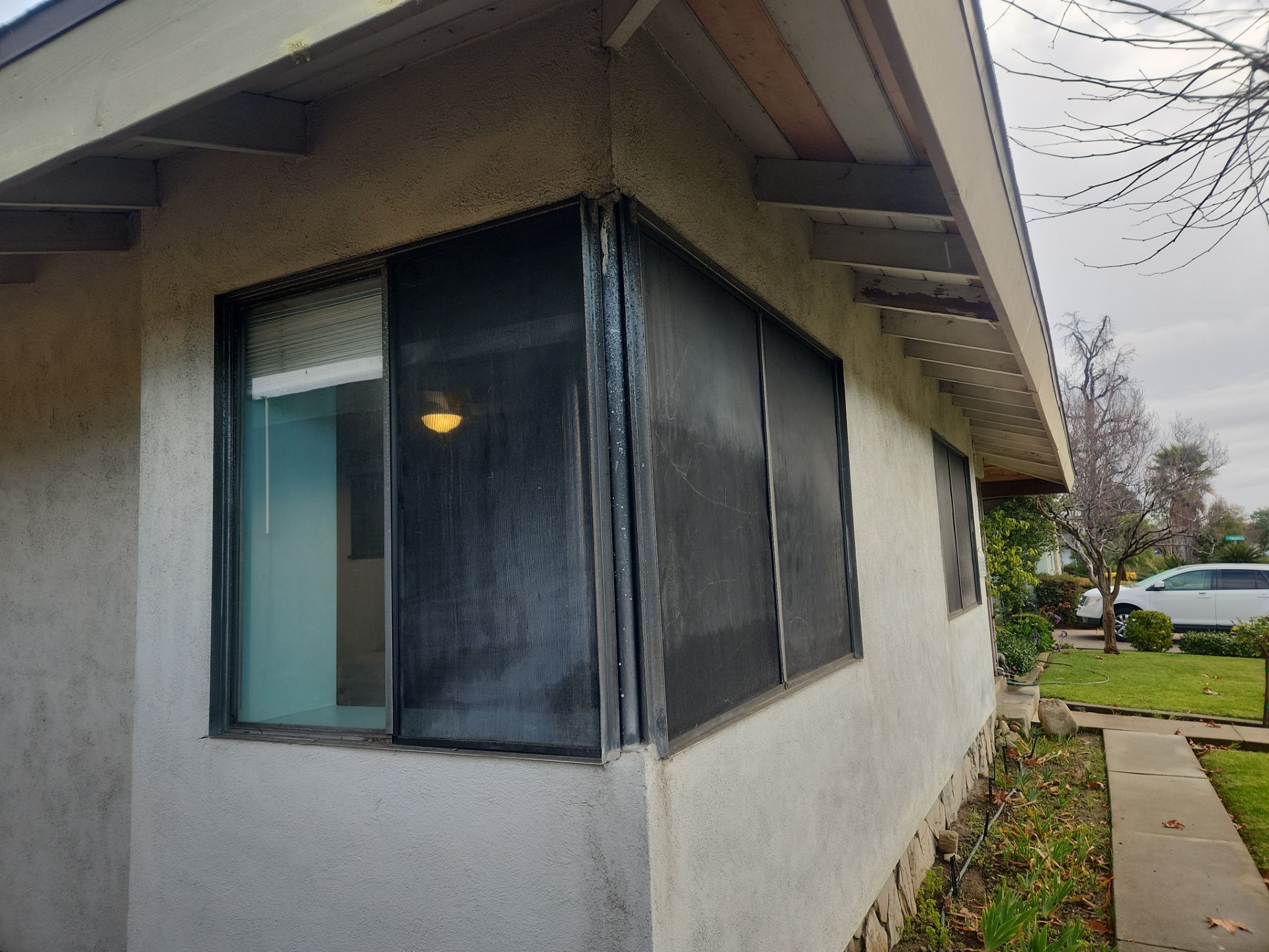 Window Installation using Black Vinyl Windows by American Window Company