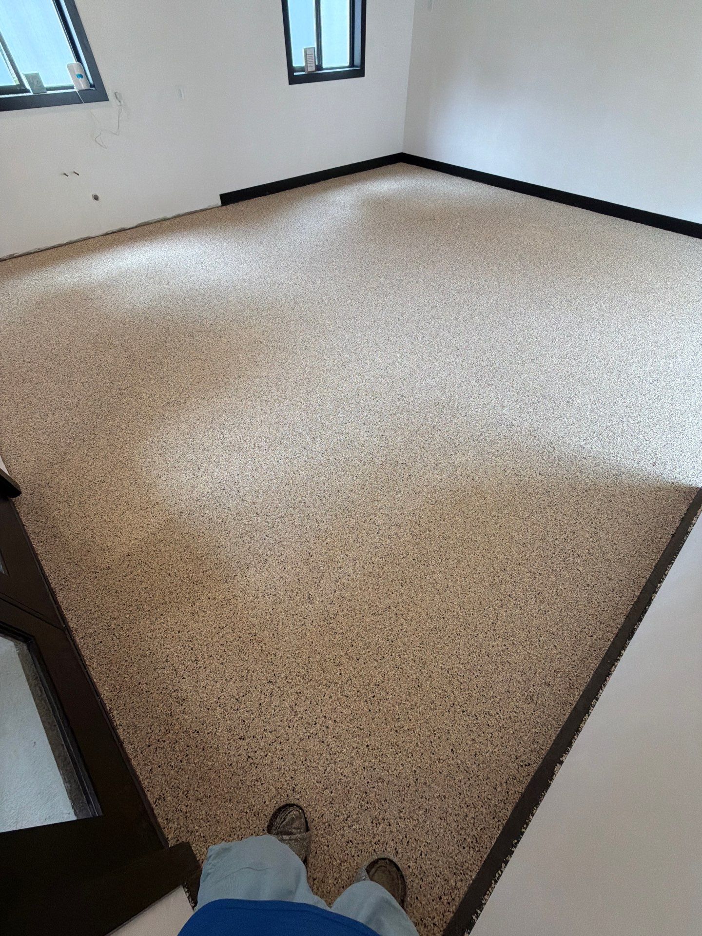 Multi-Room Epoxy Flake Floor Installation Throughout Pentwater Residence by Gordon Painting