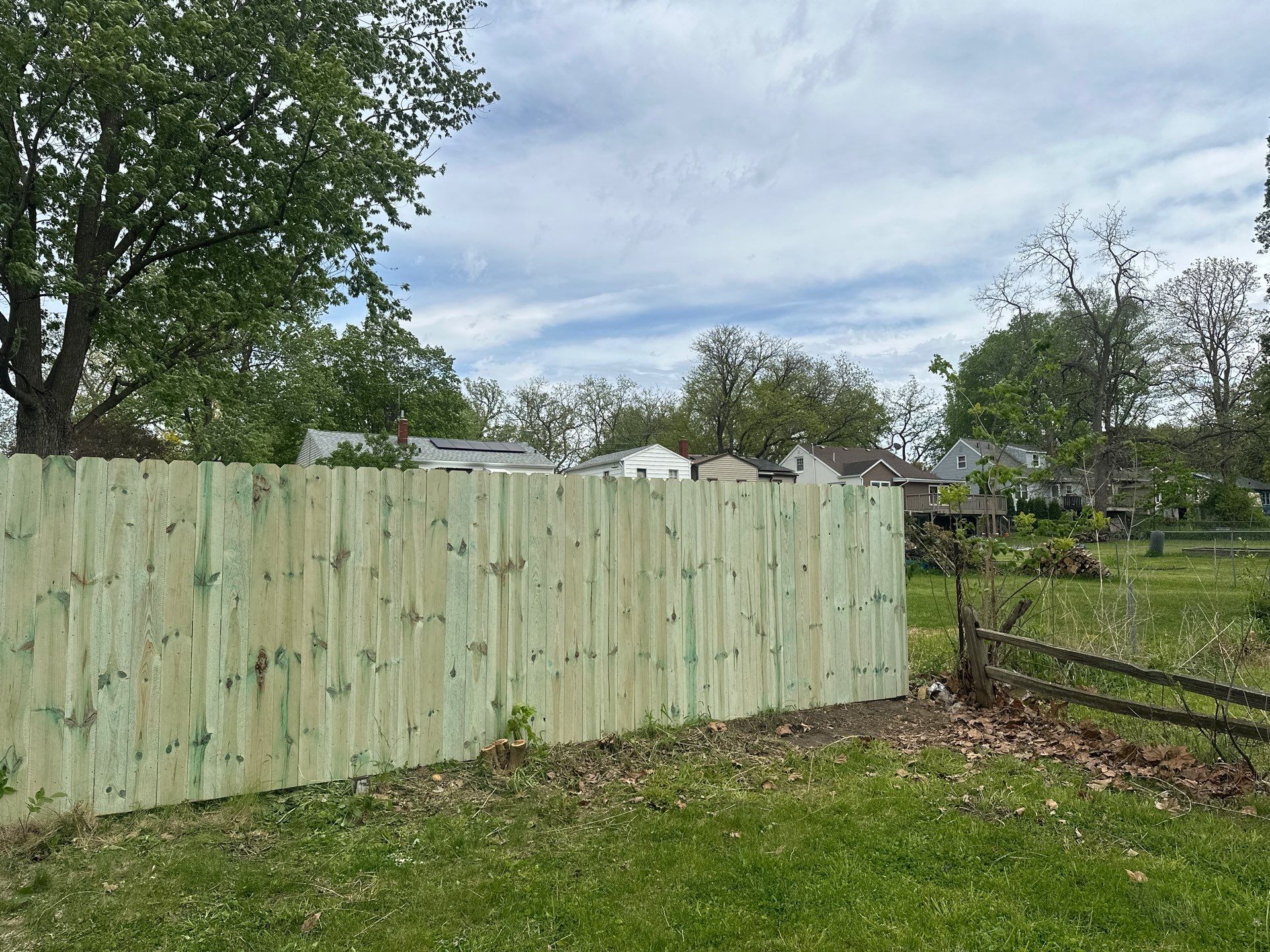 Pressure-Treated Wood Privacy Fence Installation in Waterloo by Perfect Picket Fence and Stain