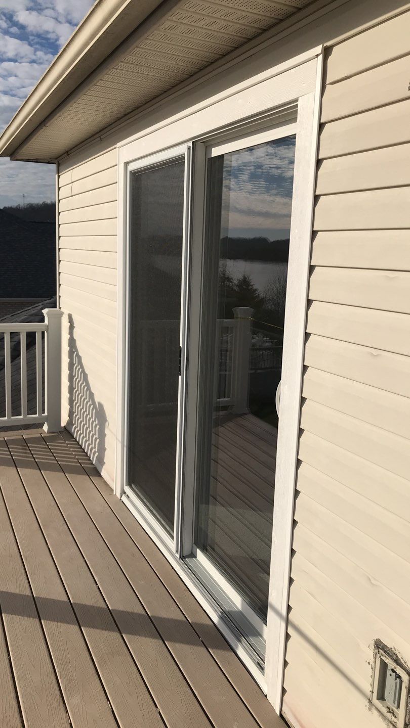 Deck Refurbush and Door Replacement using Trex Decking and Railing. Polaris Patio Doors by Secure Construction Company Inc