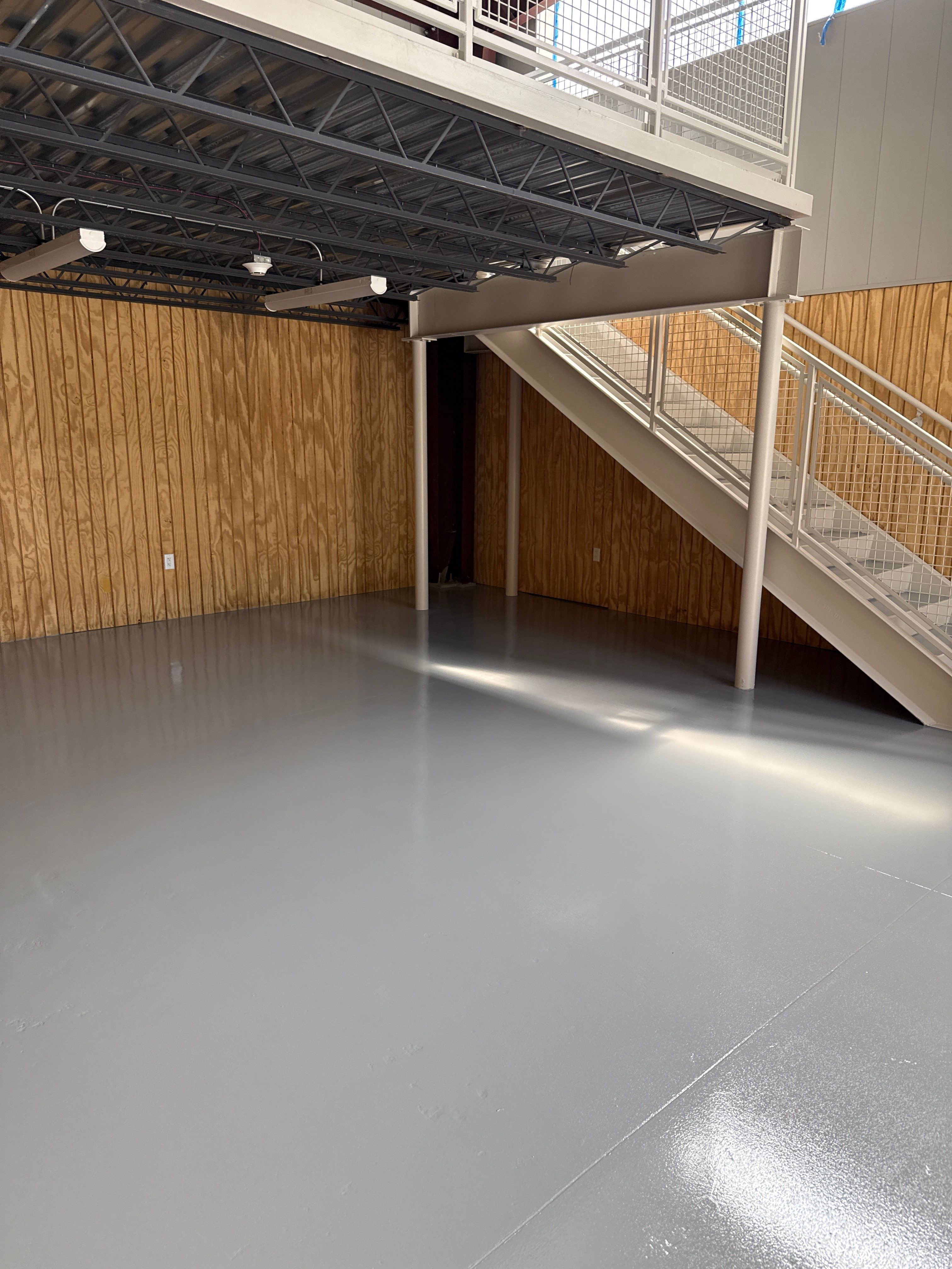 Industrial Epoxy Flooring for Sandhill Crane Workshop in Gautier by Cornerstone Hard Surface Restoration 