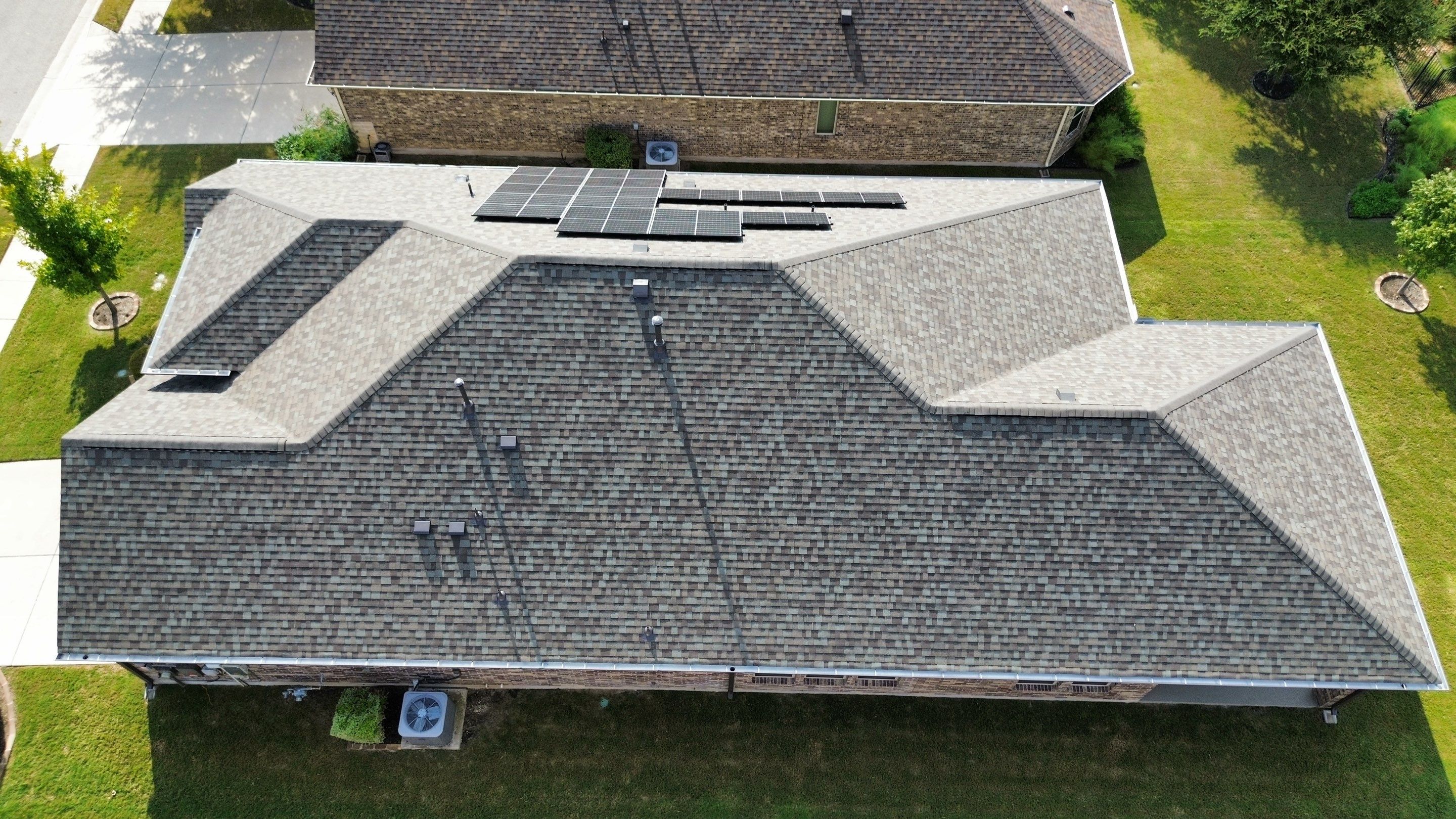 Full Roof Replacement with Solar Reinstall – Duration Driftwood | Round Rock, TX by Kstylez Roofing & Construction