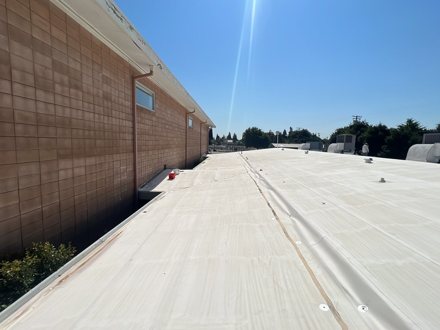 MR Roofing system using Benchmark/PUMA XL coatings over TPO single-ply roofing by Straight Edge Roofing Inc