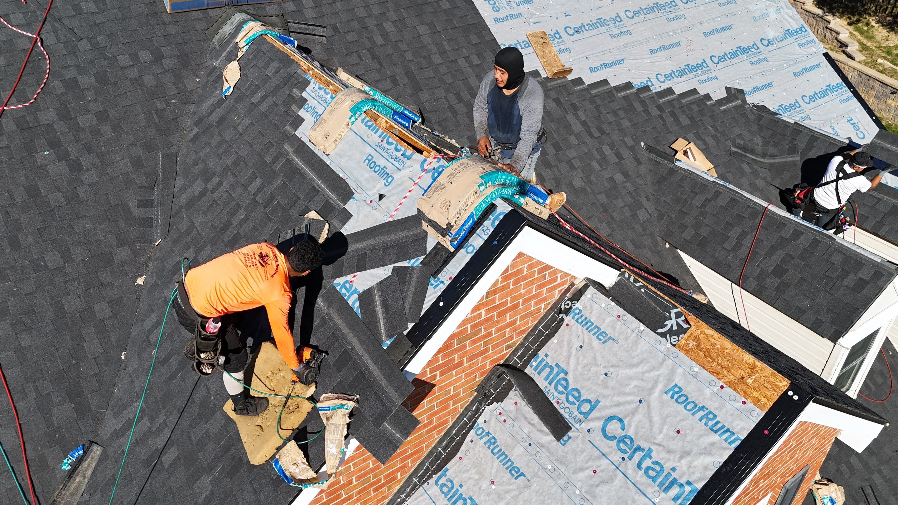 Charcoal Black Re-Roof & Gutters by Royal House LLC