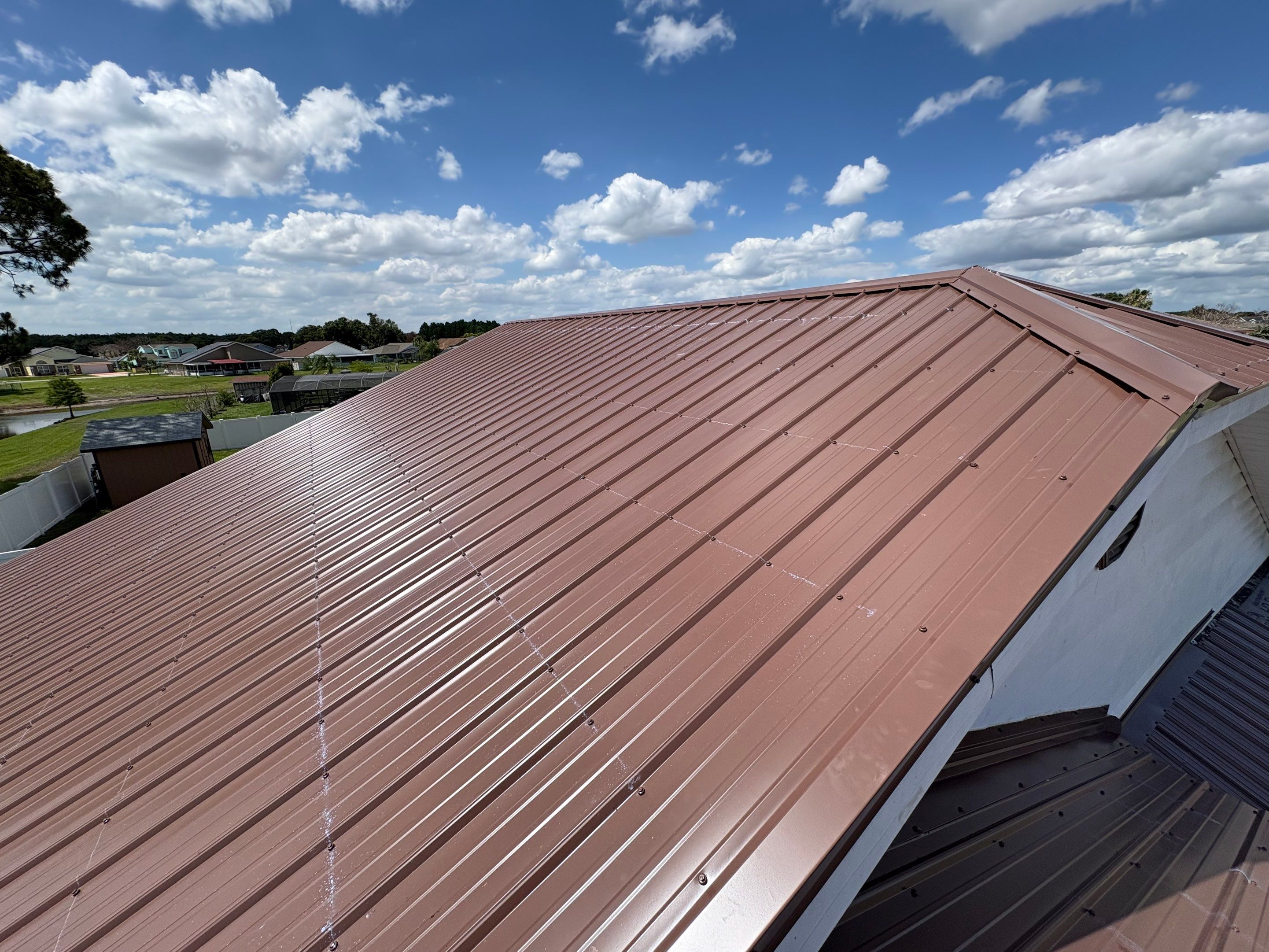 Residential Metal Roofing Installation and Gutter Replacement in Kissimmee by Pinnacle Roofing Group