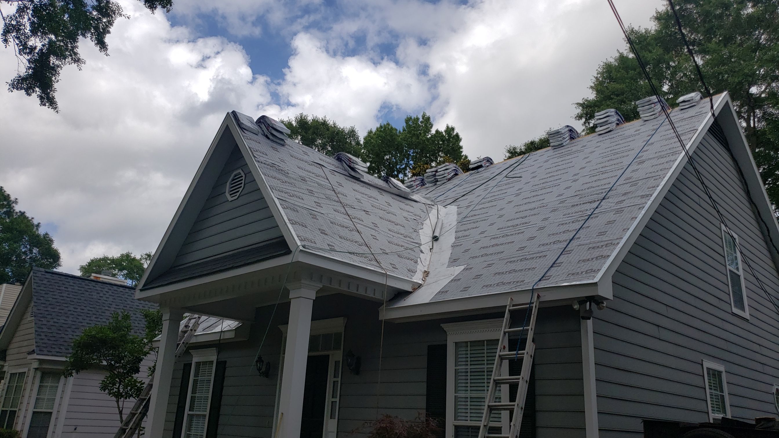 Residential Roofing Installation using Roof Replacement by American Roofing & Construction LLC