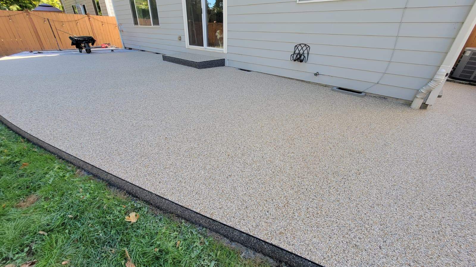 Beautiful Patio in Sistine Chapel and Manhattan Vuba Stone by Concrete Coating Experts Inc.