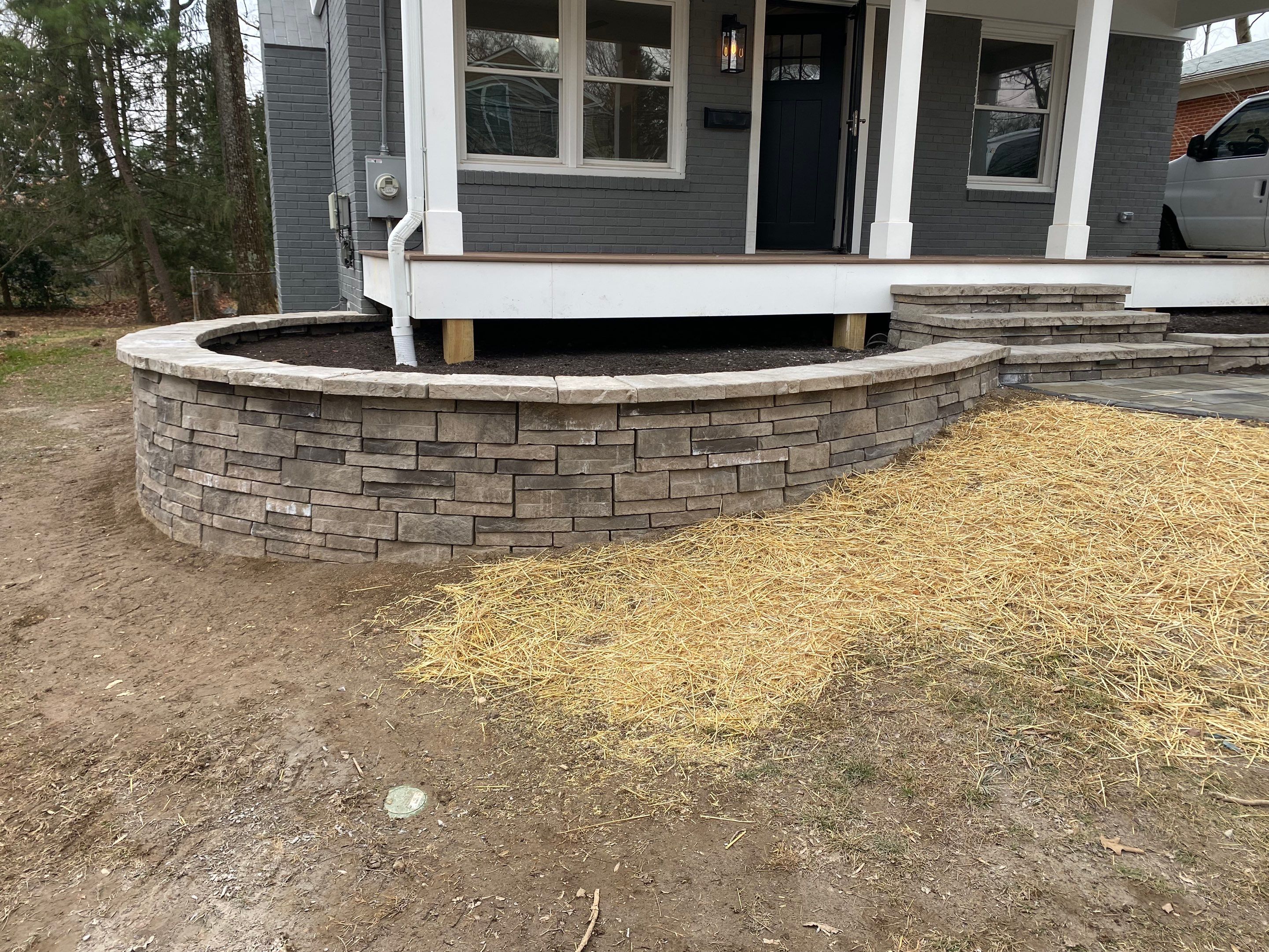 Retaining wall, walkway, small patio and landscape install by The Smet Companies, LLC