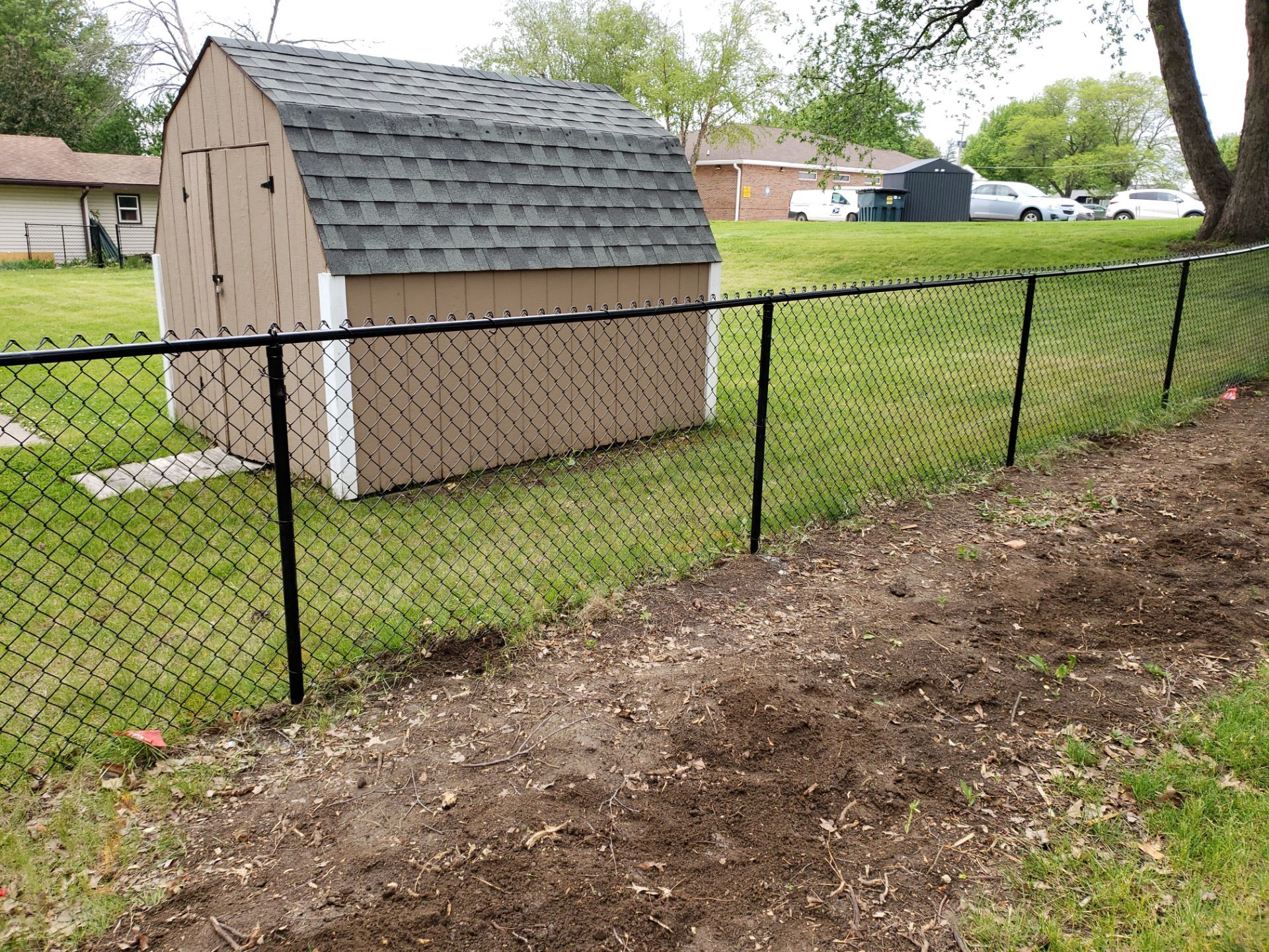 Chain Link and Cedar Privacy in Grundy Center by Perfect Picket Fence and Stain
