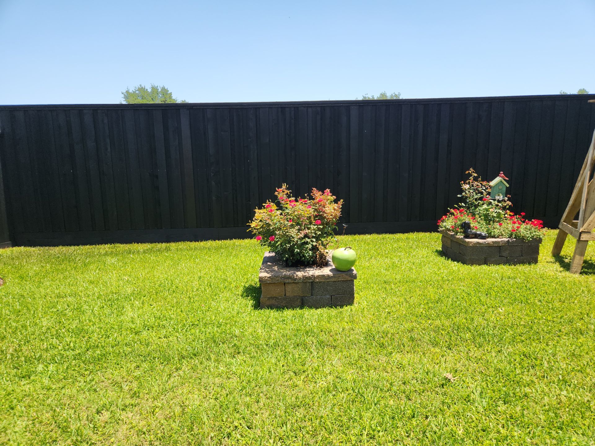 Modern Black Fence Finish by Tim's Fences