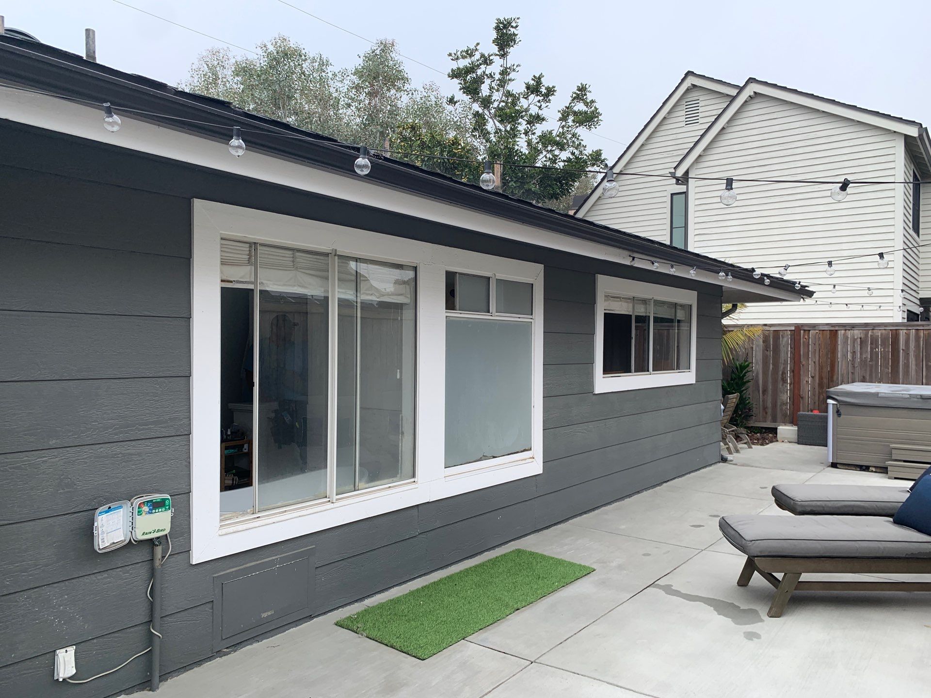 Window Installation using Milgard black vinyl windows by American Window Company