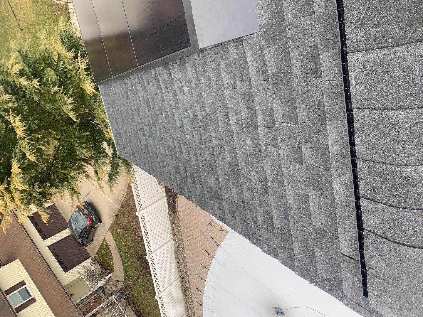 Roof Replacement with GAF Decotech integrated solar panels by American Home Contractors
