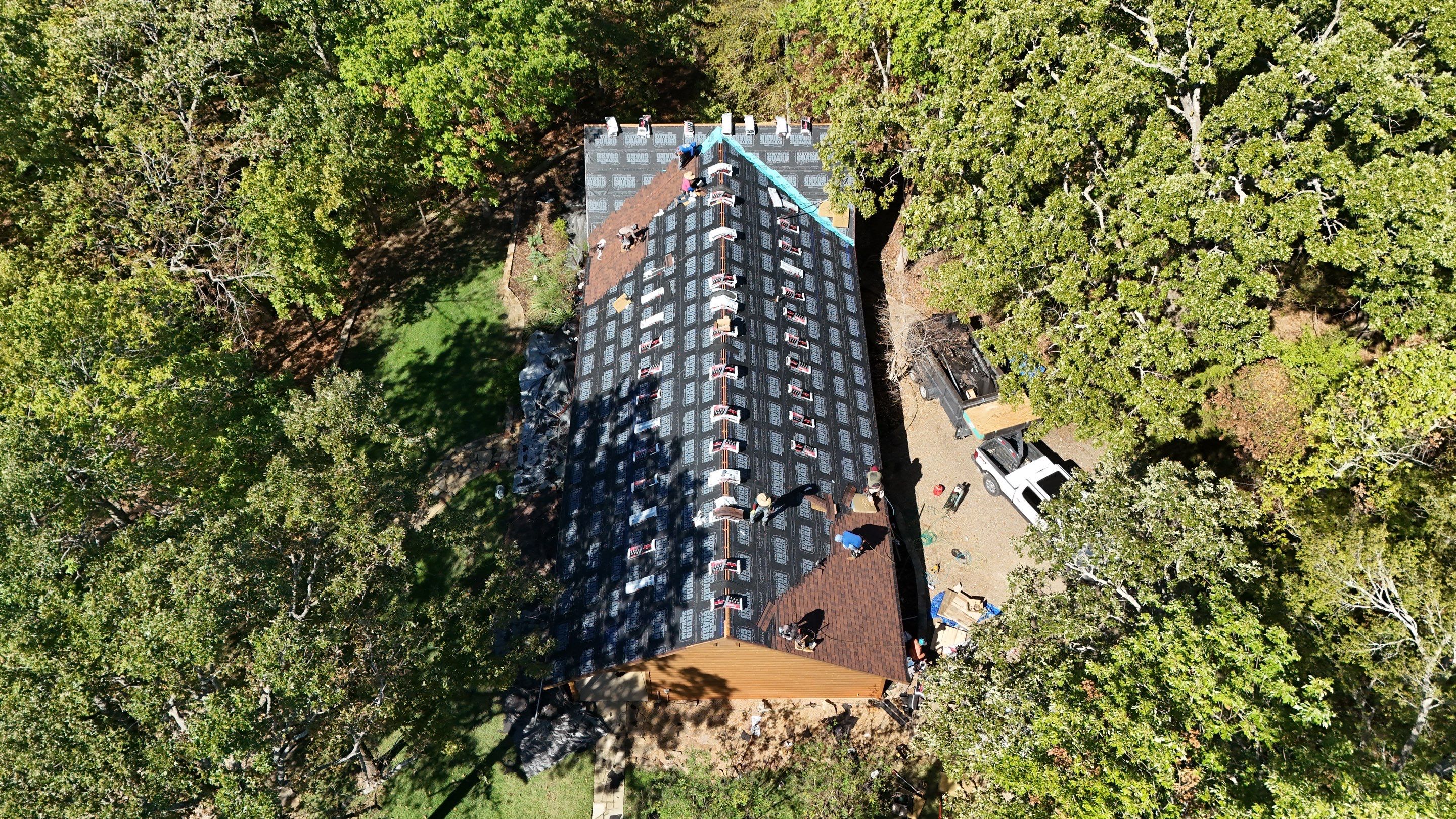 Multi-Building Log Cabin Roof Replacement with Architectural Shingles in Quitman by Armor Roofing | Exteriors