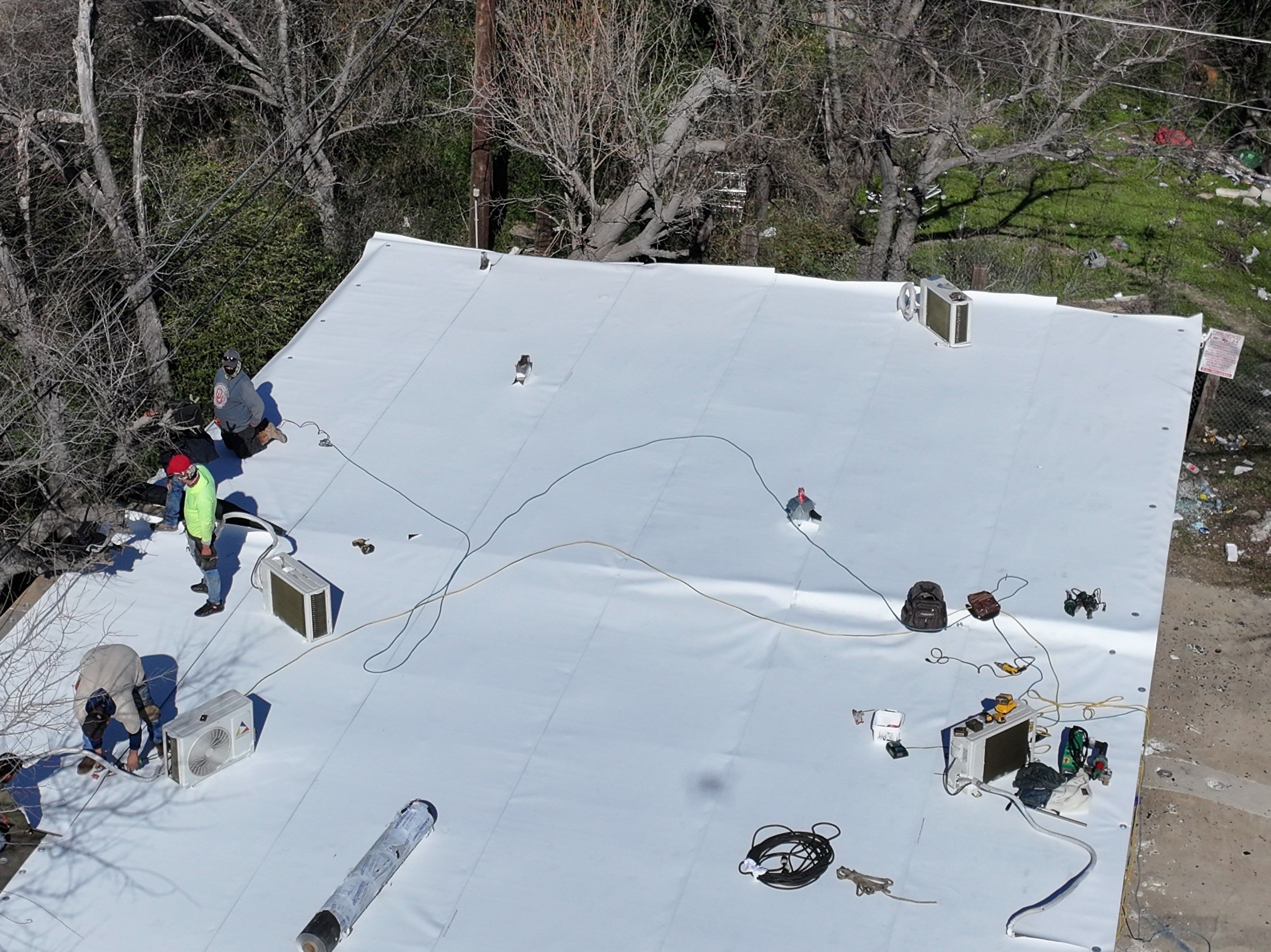 Commercial roofing overlay using GAF TPO over an old ballast roof by Becker Roofing and Exteriors
