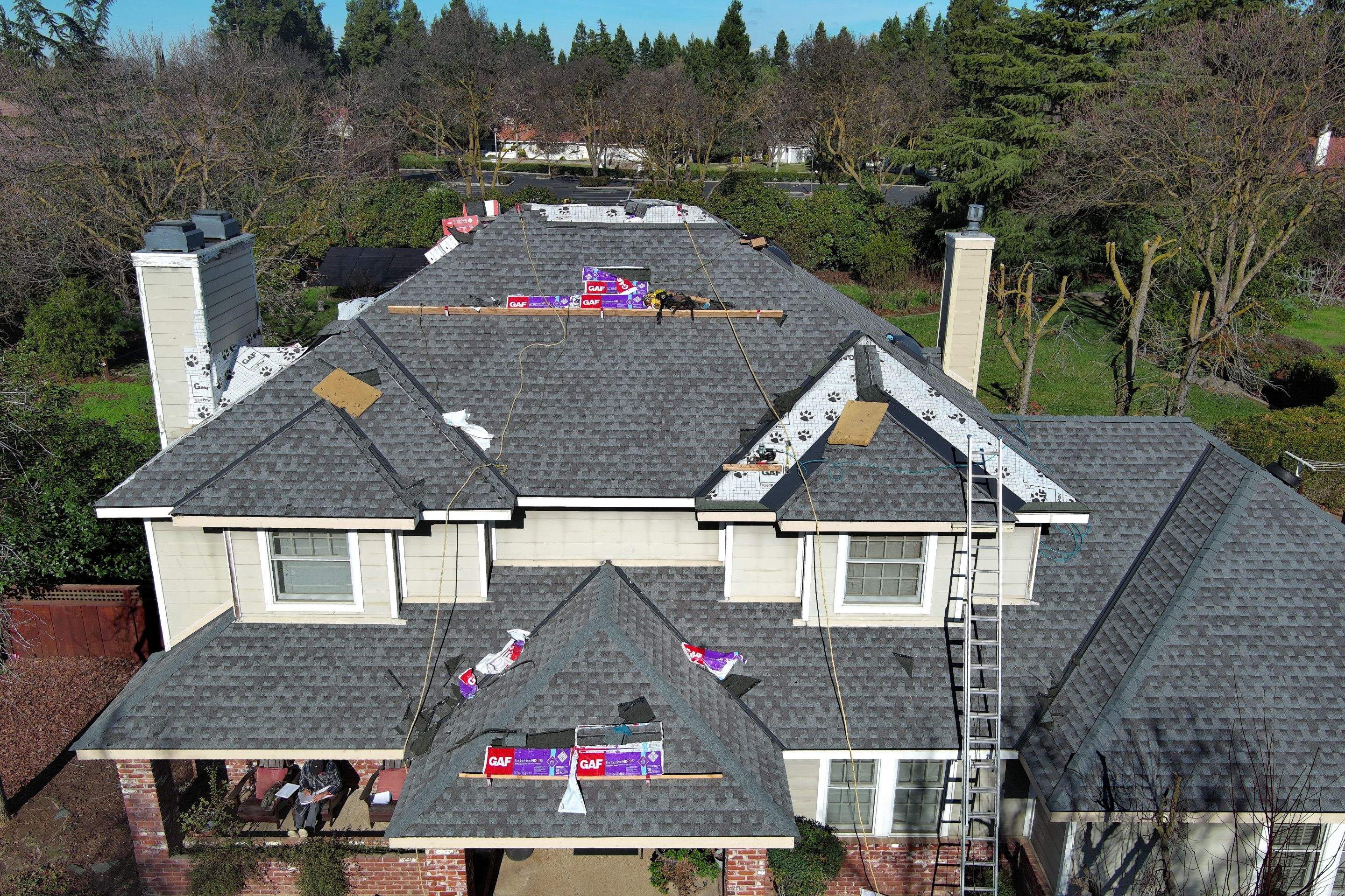 New shingles and gutters using GAF Timberline HDZ shingles and aluminum gutter by Straight Edge Roofing Inc