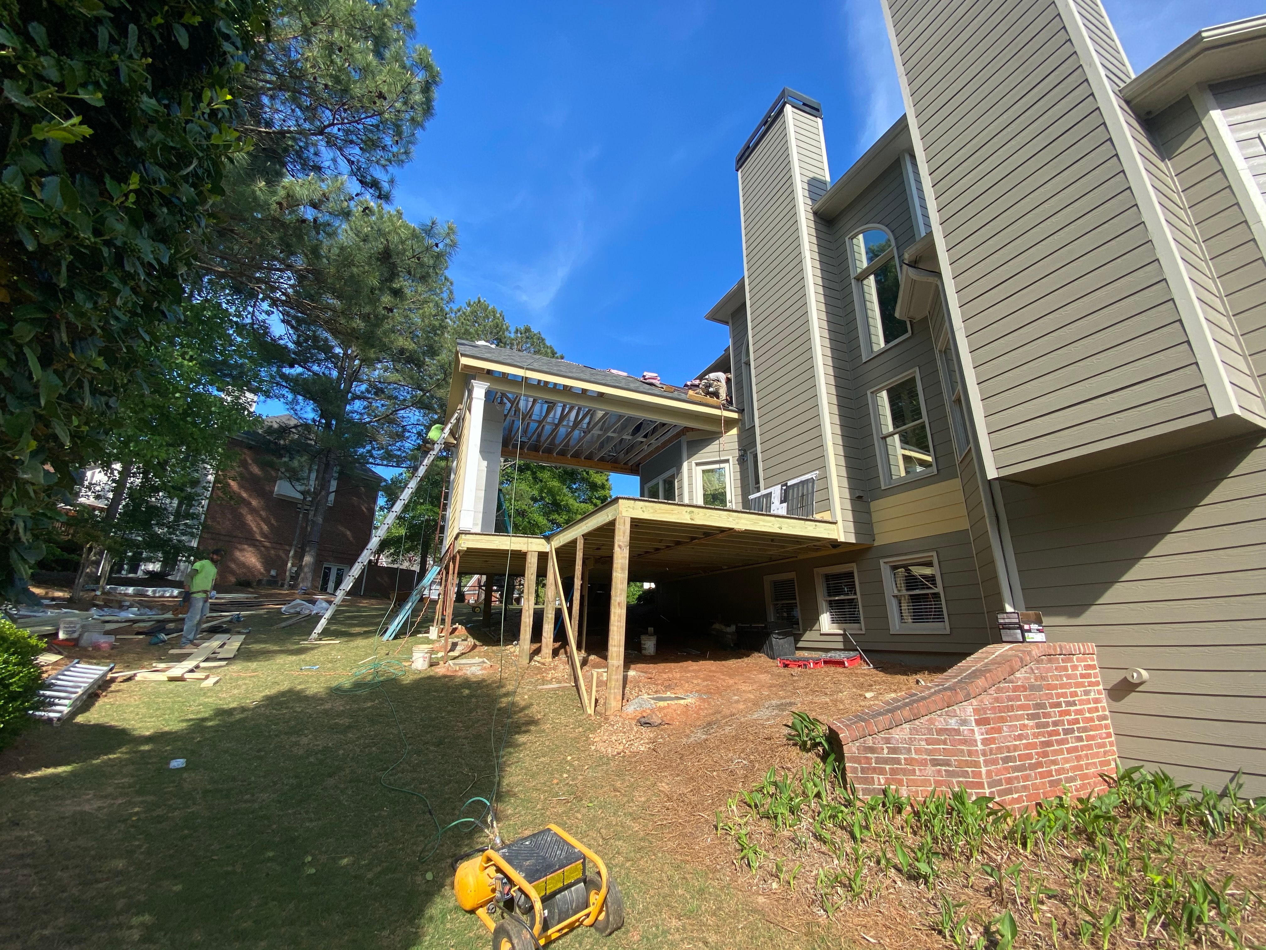 Covered Porch and Composite Deck Addition in Woodstock by Swift Home Renovations