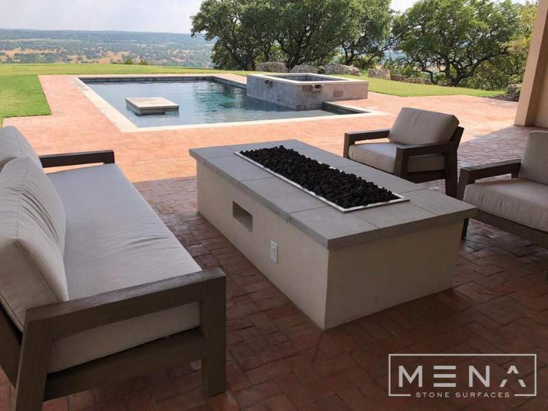 Kitchen, outdoor kitchen and pool brick floor installation by Mena stone surfaces