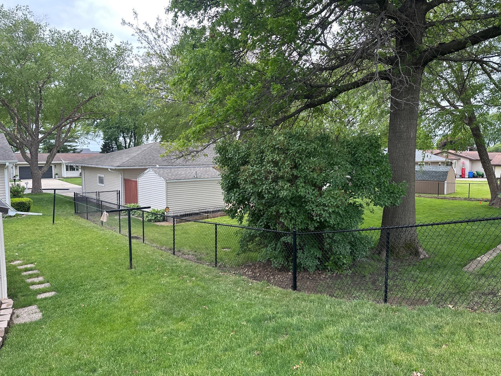 Chain Link and Cedar Privacy in Grundy Center by Perfect Picket Fence and Stain