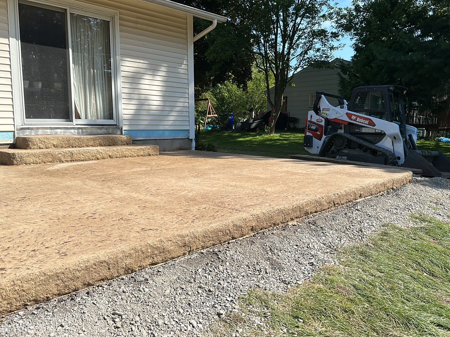 Bluestone textured stamped concrete patio by NG Masonry & Construction LLC