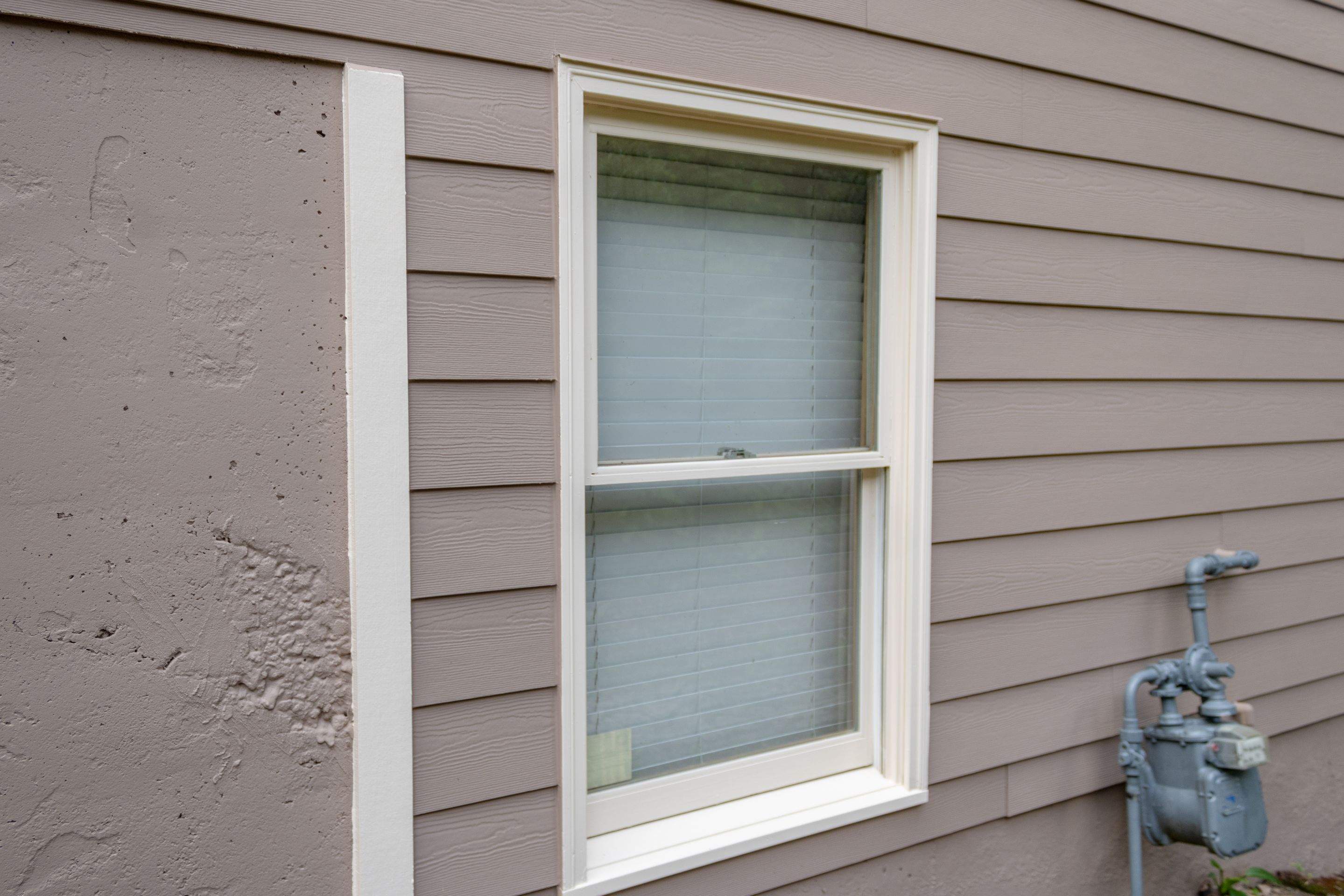 Exterior Painting using Sherwin-Williams and Rotted Wood Replacement by Nelson Exteriors 