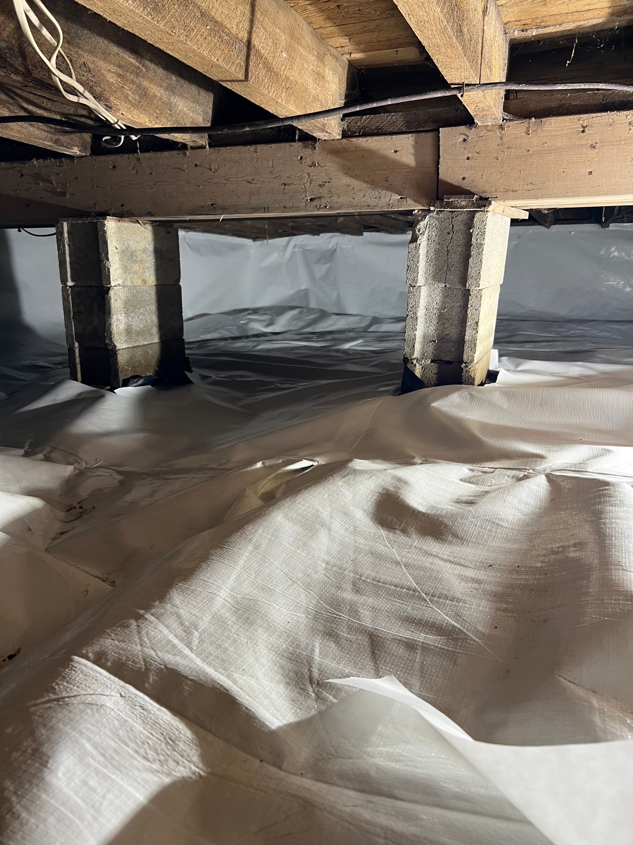 Crawl space encapsulation and Waterproofing using GrateDrain Waterproofing System by Toledo Basement Repair 