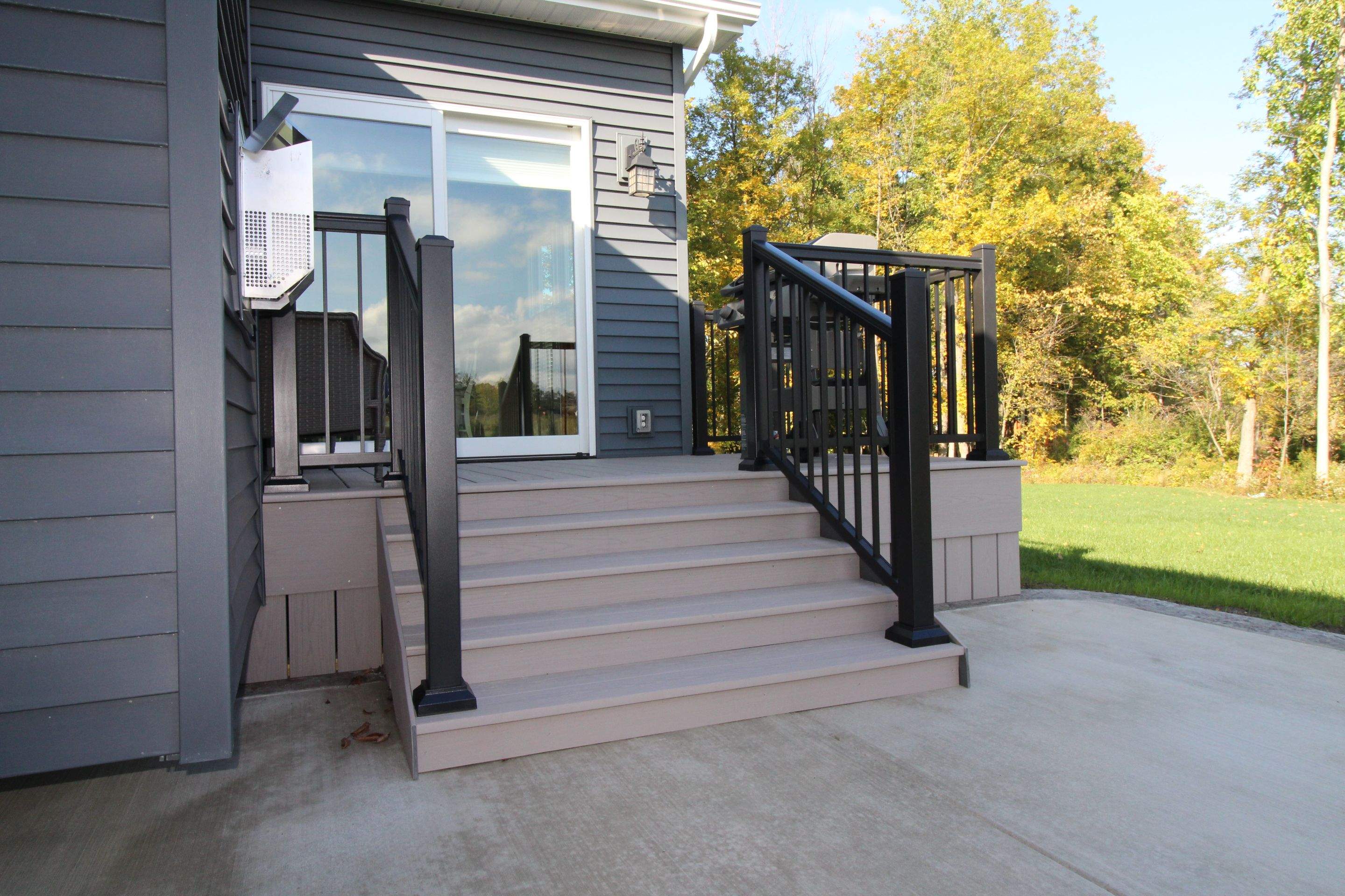 Outdoor Living- Deck and Concrete by Ivy Lea Construction