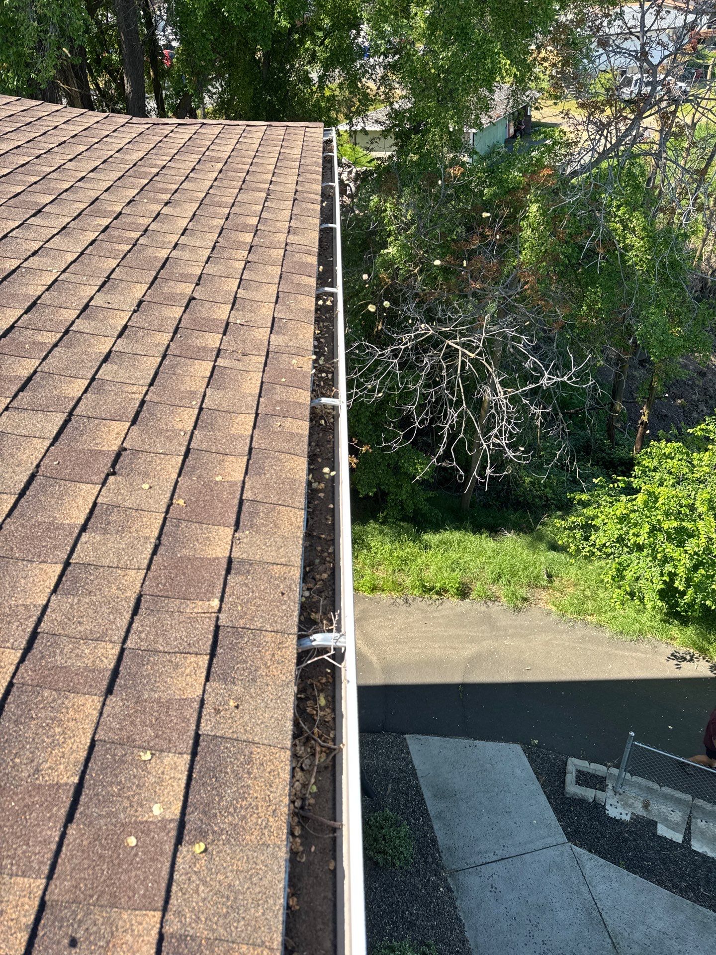 Commercial gutter cleaning Walla Walla, WA before photo with filled gutters