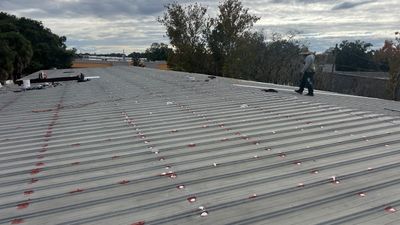 Industrial Metal Roof Restoration With Silicone Coating in Winter Park