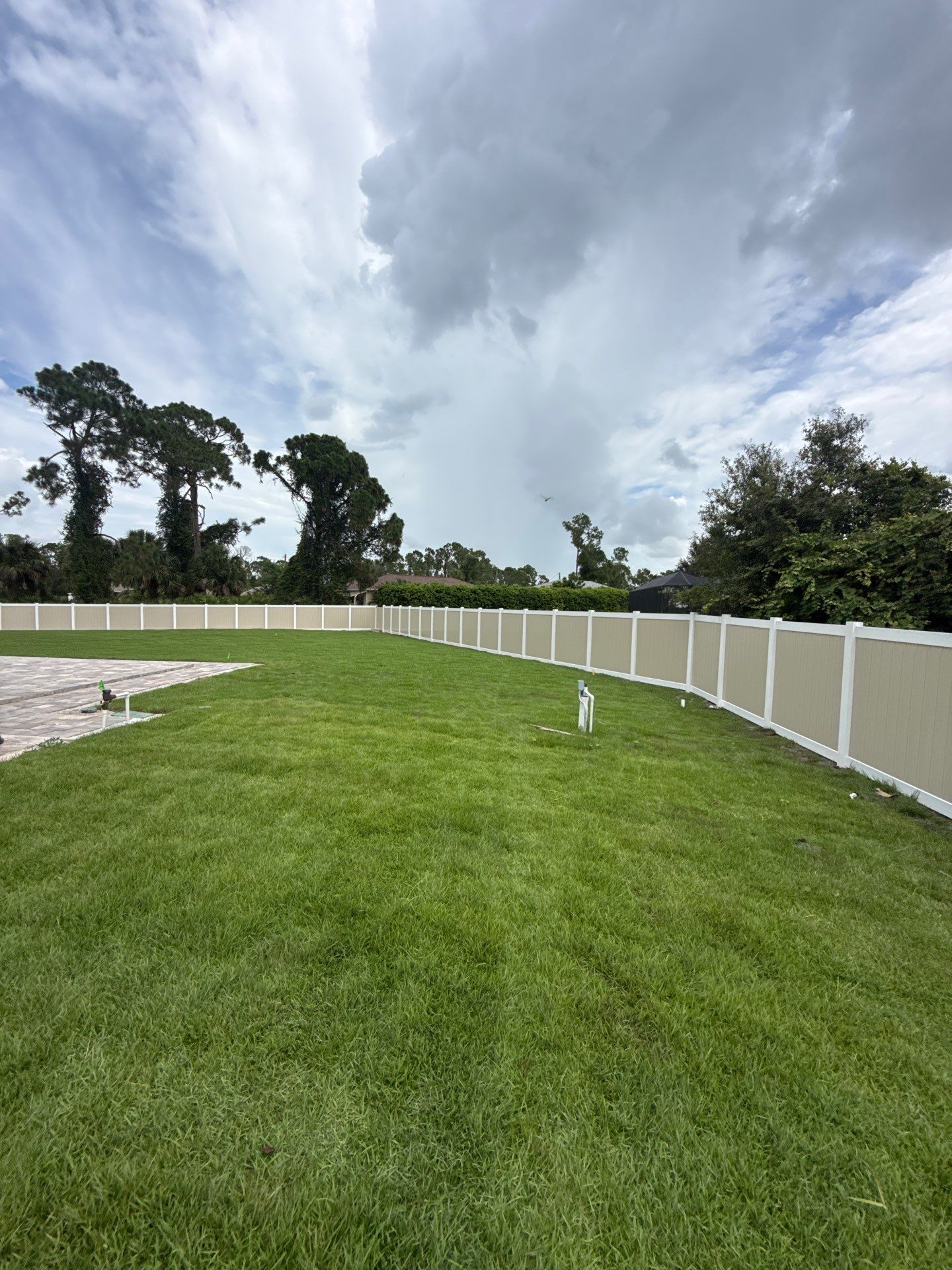 Custom Two-Tone Vinyl Privacy Fence Installation in North Port by True Fence LLC