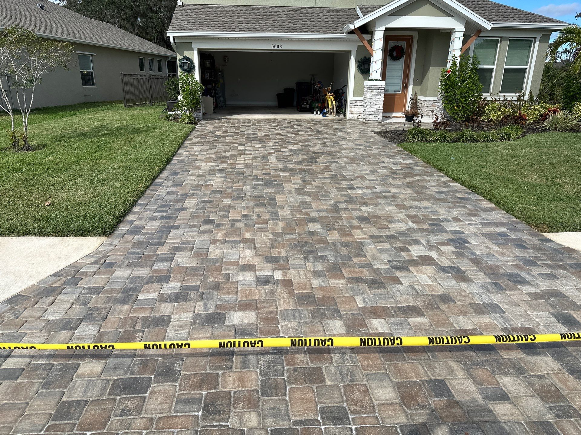 House Wash, Paver Driveway & Sidewalk Cleaning + Sanding & Sealing in Trevesta Community, Palmetto, FL by Sunshine AquaWash