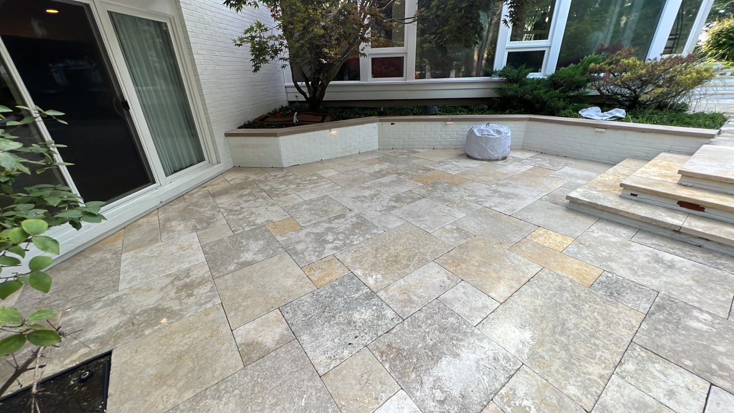 marble patio cleaning and sanding using Polysweep polymeric sand by Northern Power Washing LLC.