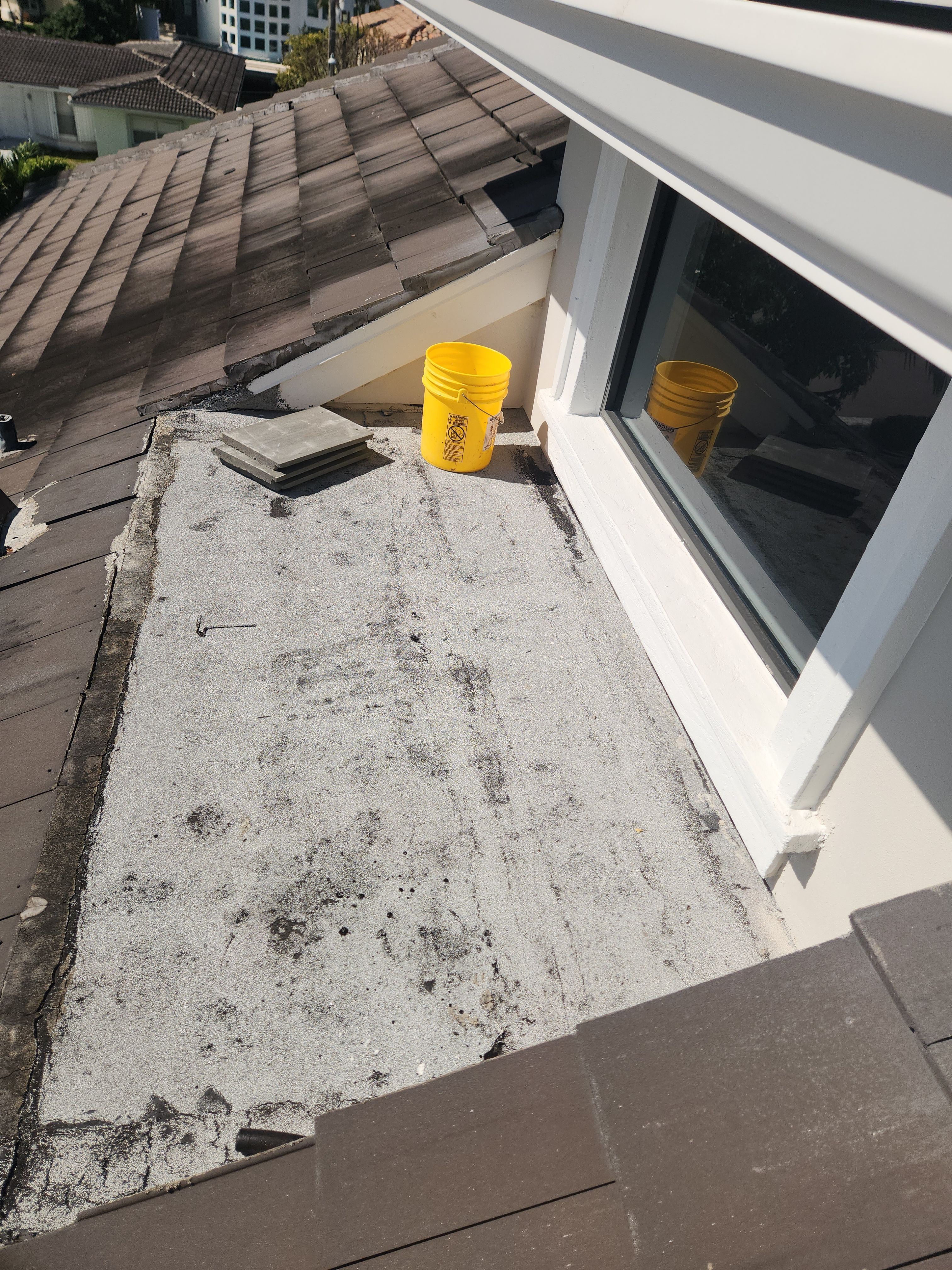 Silicone roof coating and tile tune up in Boca Raton by Aastro Roofing
