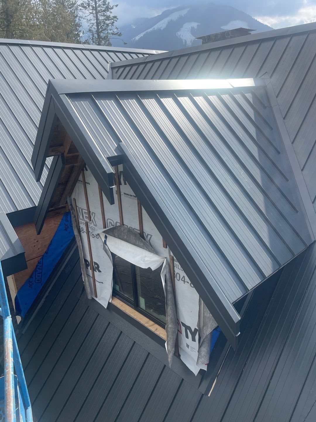 Residential Roofing Installation using 12" Prolok metal by Top Notch Roofing Inc