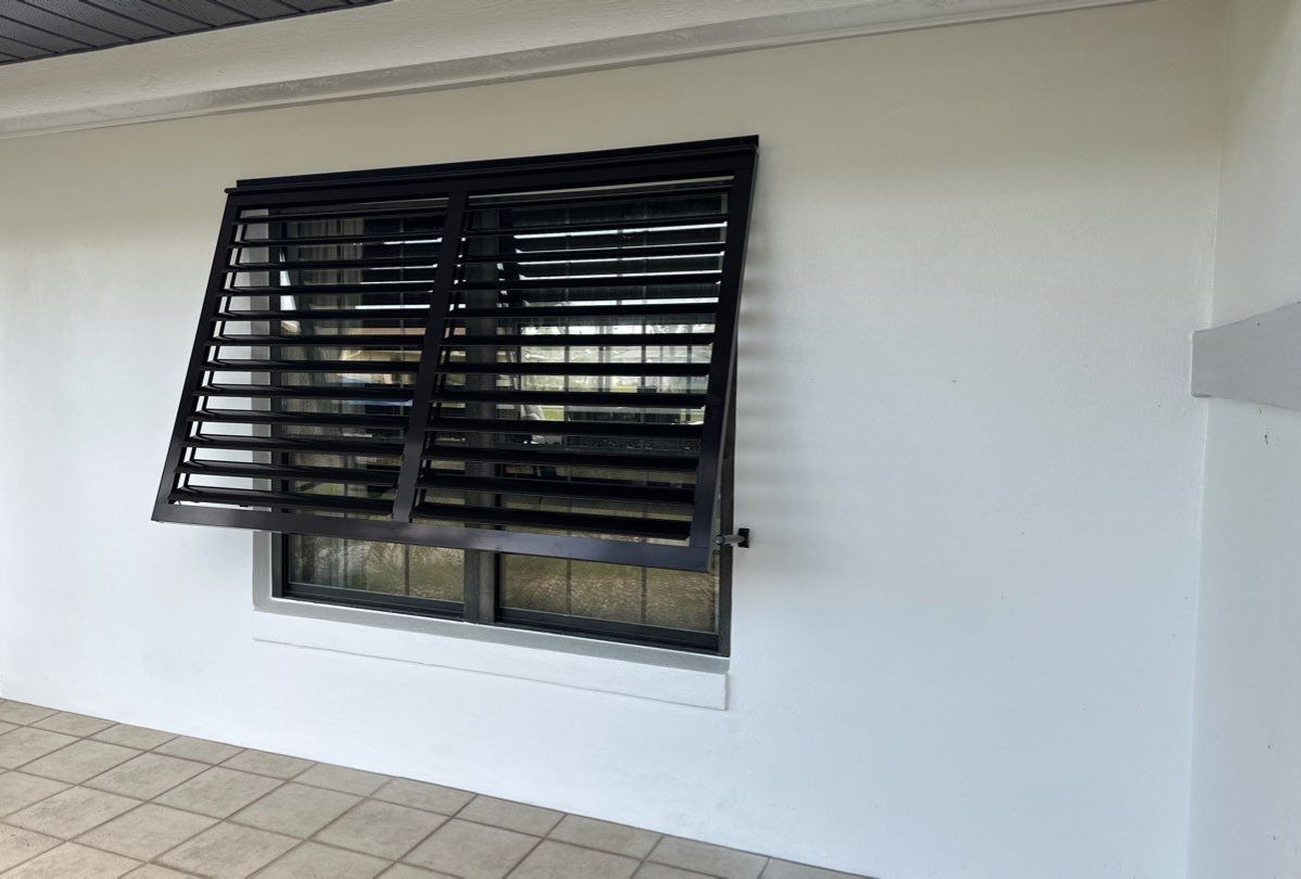 Bahama Shutters in Grey Brown by Smart Guard Shutters