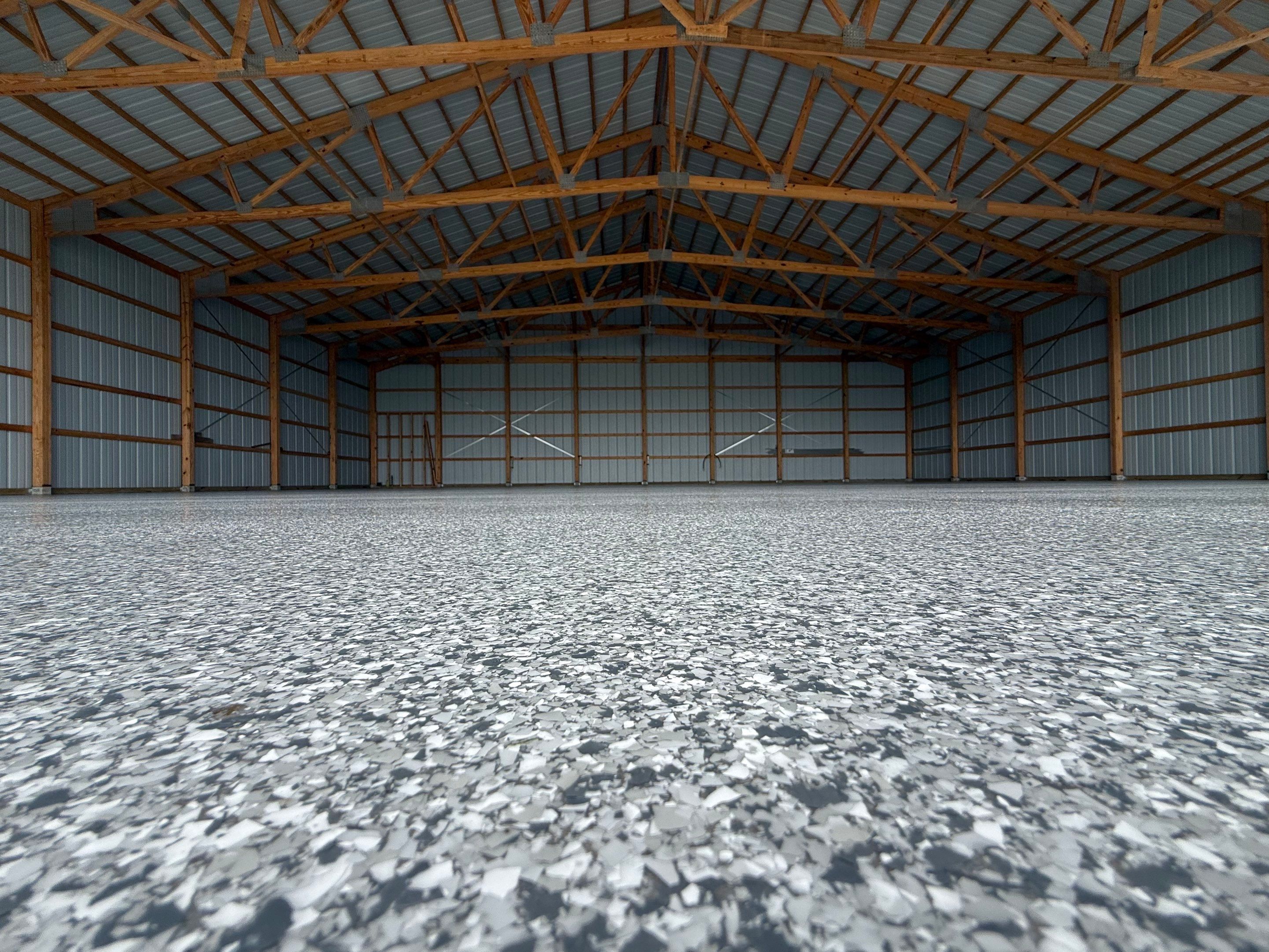Durable Grey Speckled Epoxy Floor Coating for Yankton Shop by Select Painting, Coatings & Garage Cabinets