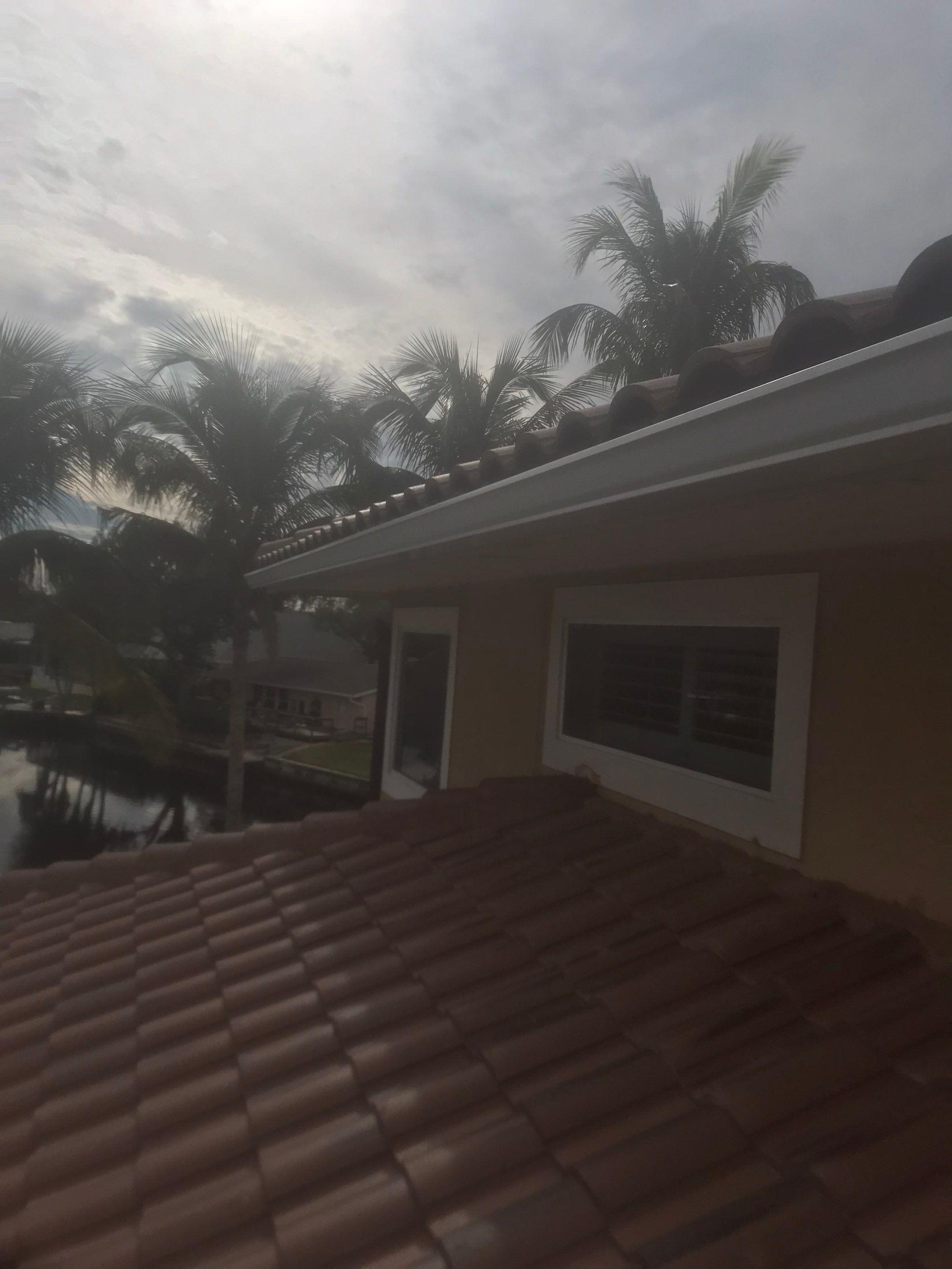 6 Inch Seamless Gutters using White Gutters and Downspouts in Fort Myers FL by Gutter Professors